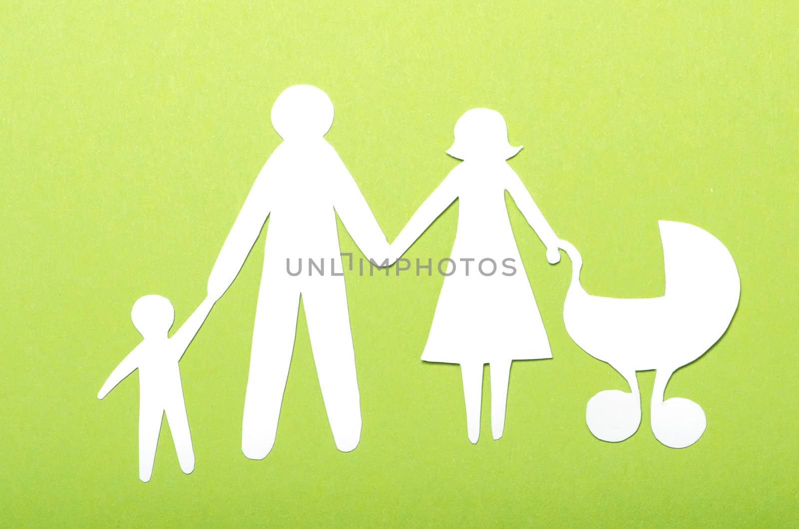 Closeup of paper family on green background