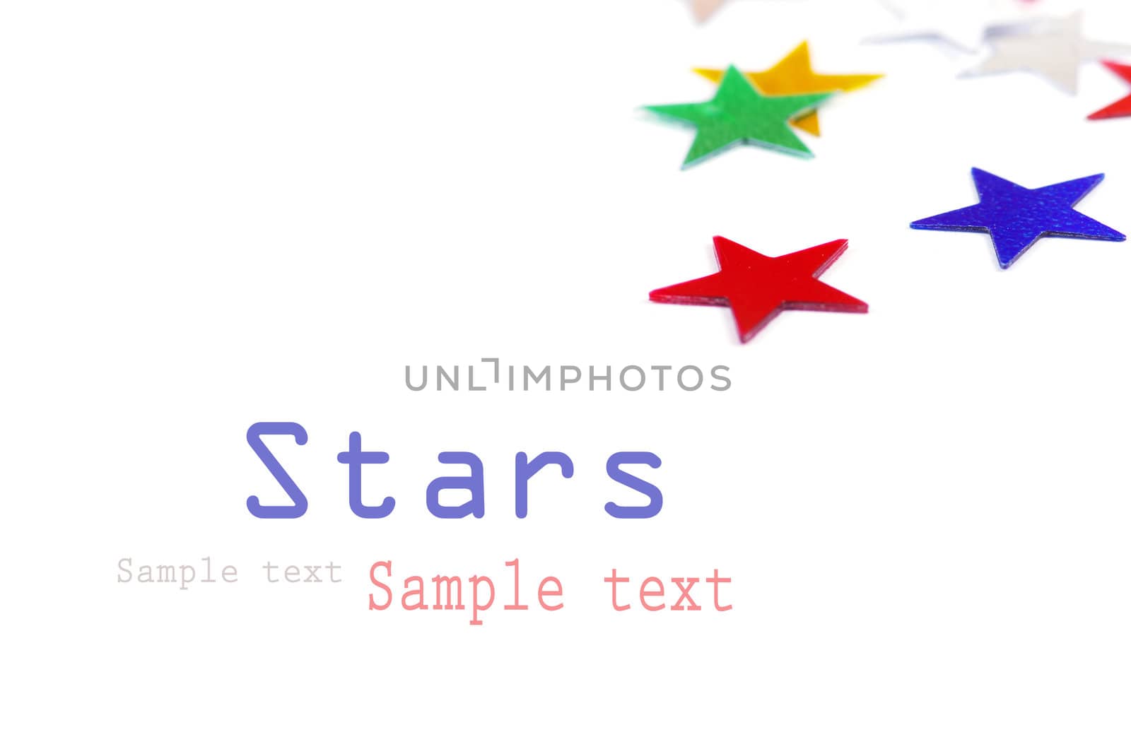 Christmas decoration of colored confetti stars against white background
