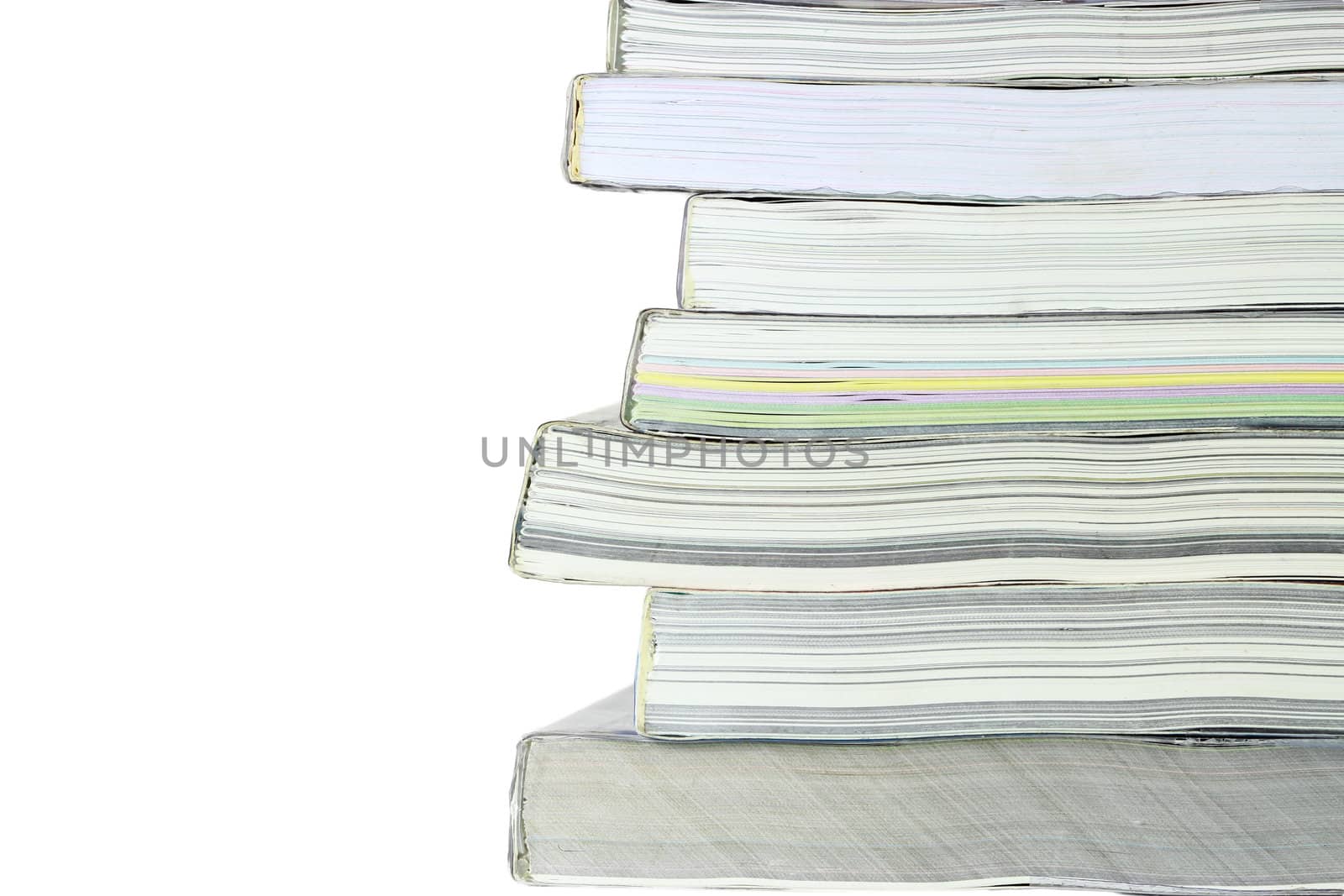 Stack of books on white background, partial view.