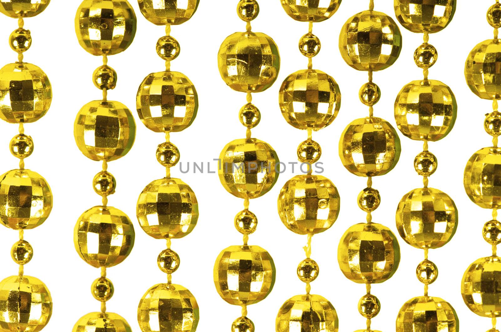 Background made of a brilliant celebratory beads of golden color
