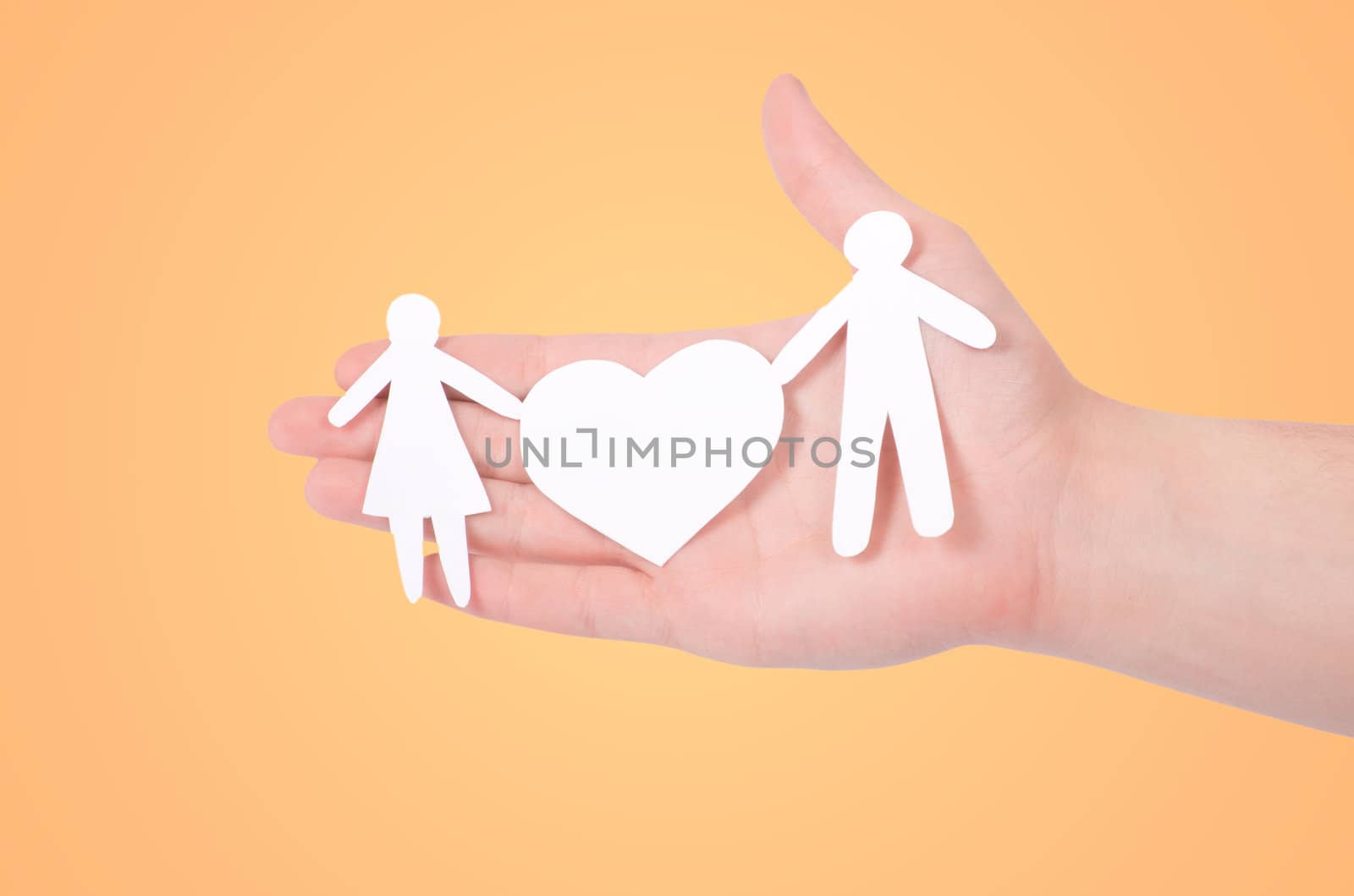 paper family in hands isolated on white
