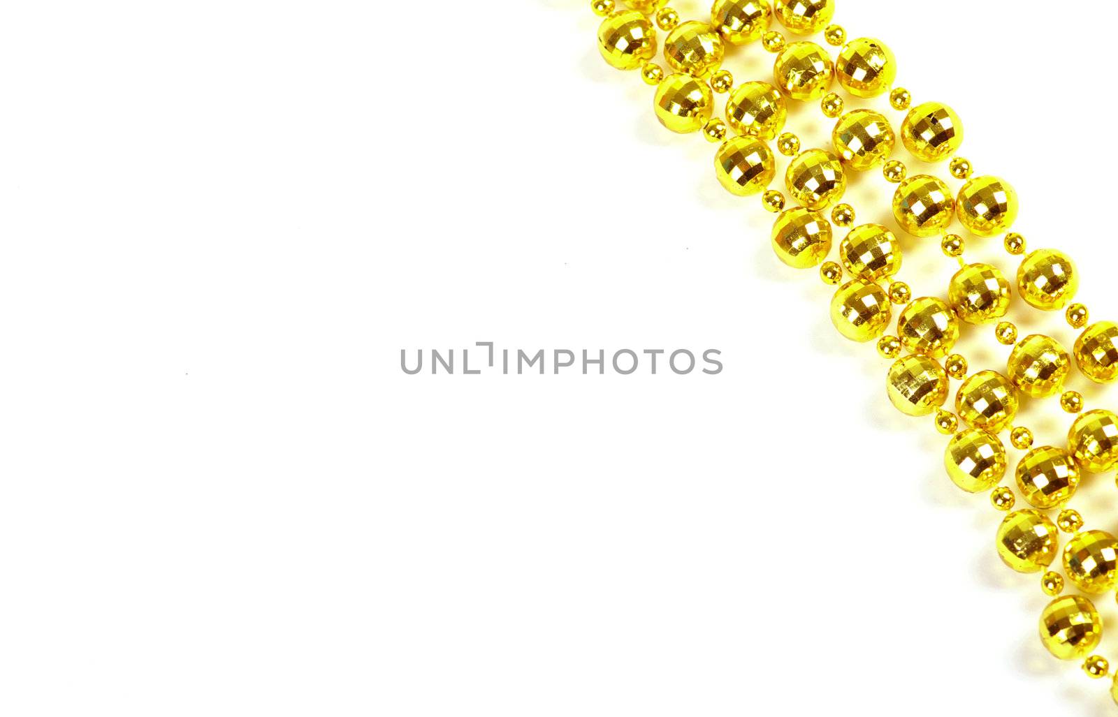 Background made of a brilliant celebratory beads of golden color