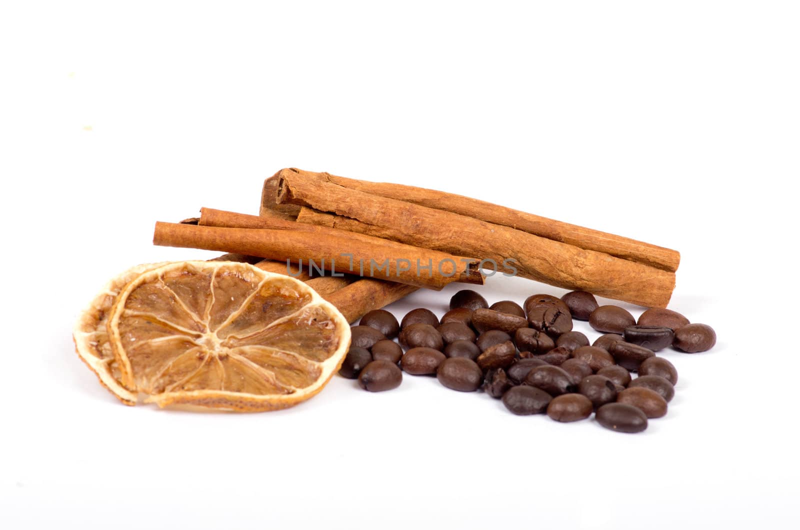 coffee beans, cinnamon and lemon isolated on white