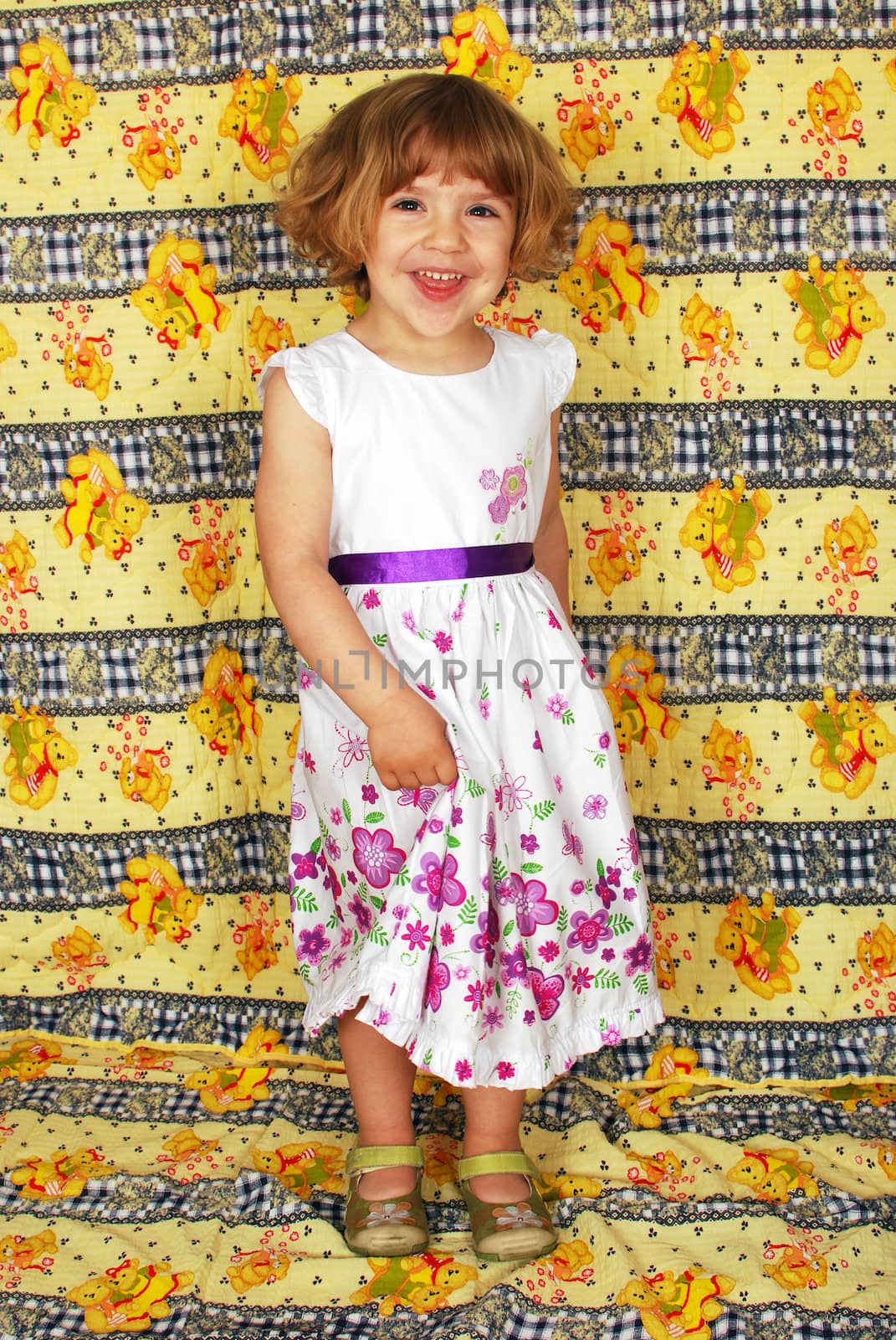 Beauty happy little girl in white dress