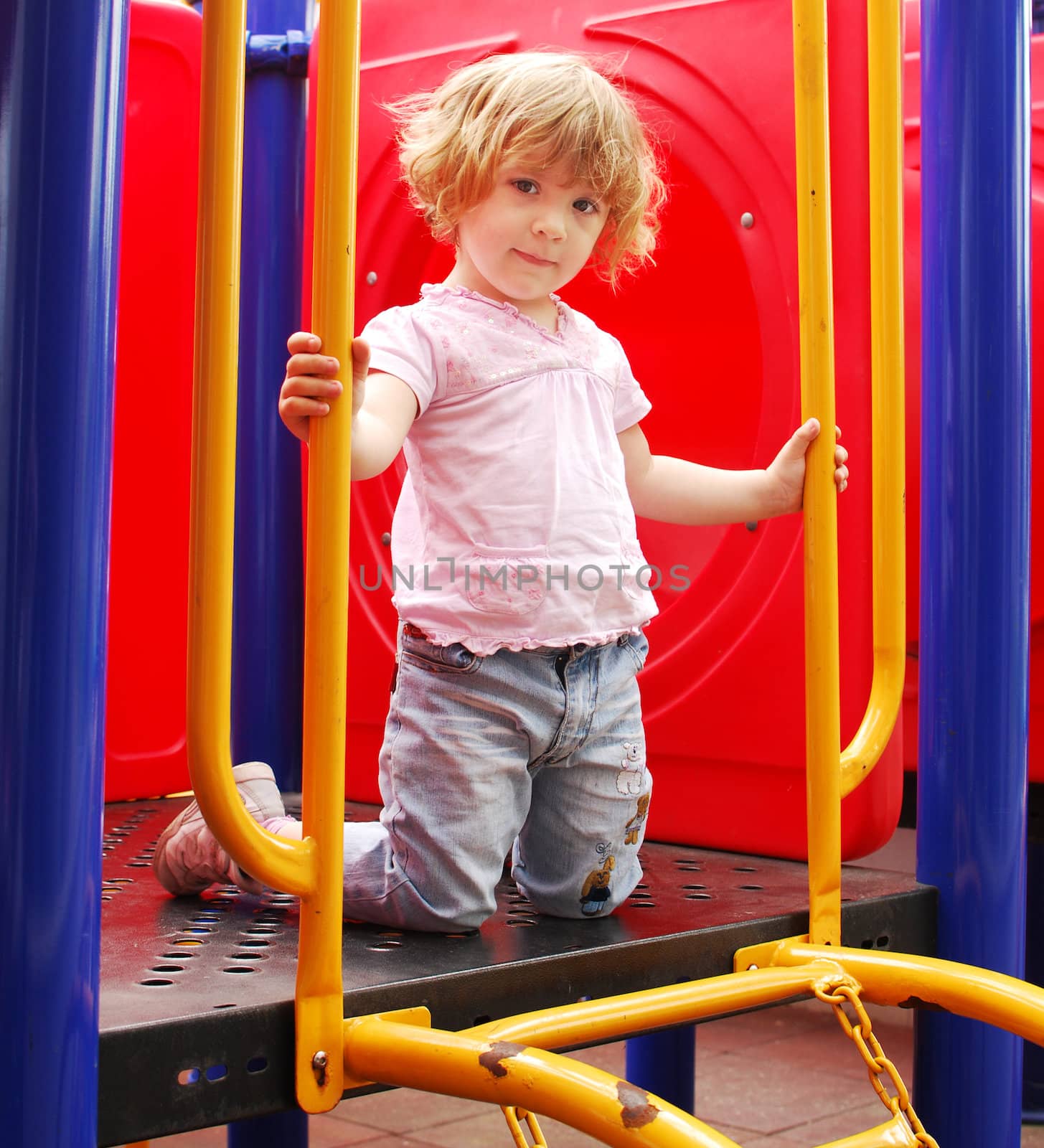 Beauty little girl posing on playground