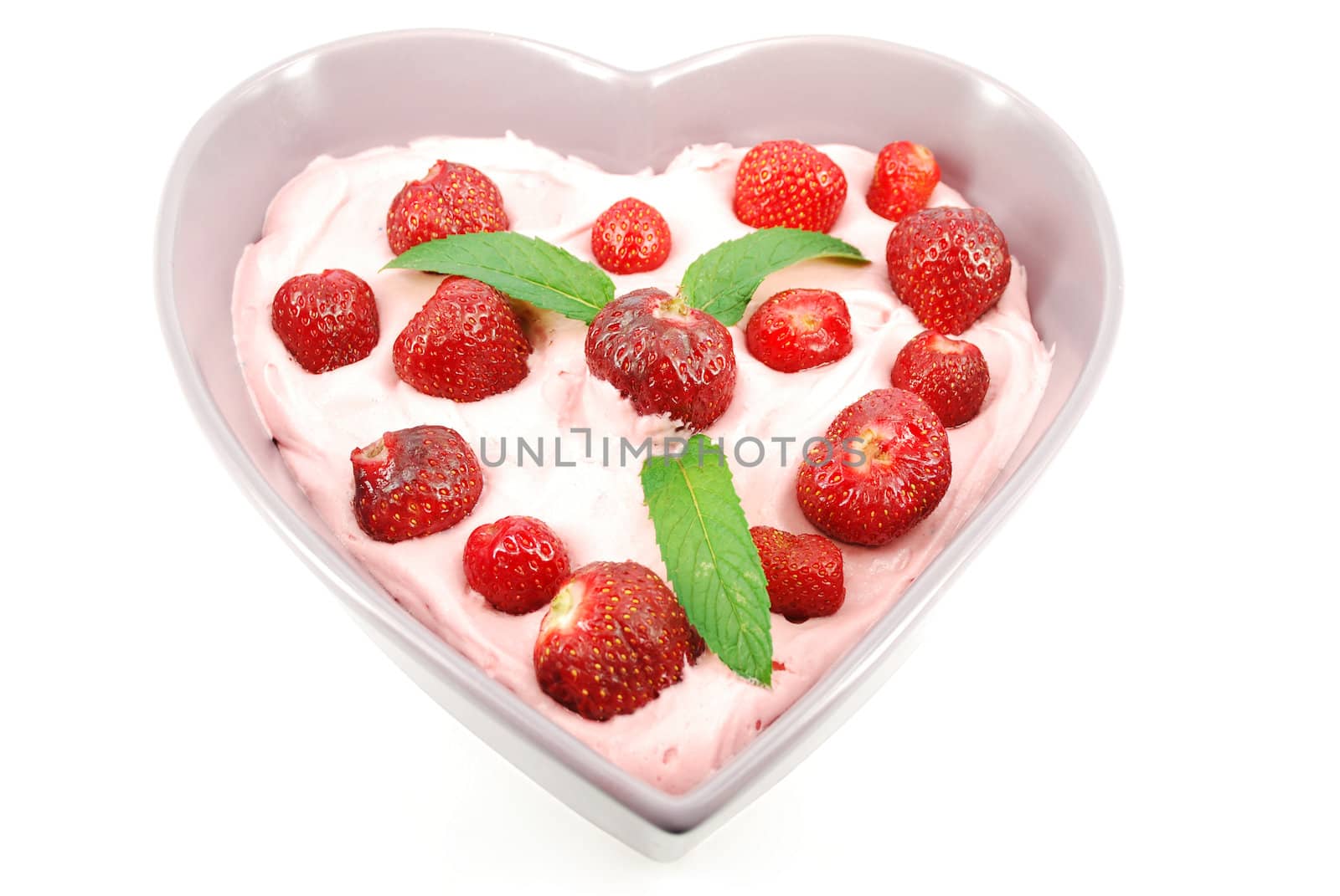 Strawberries with cream in heart shape plate