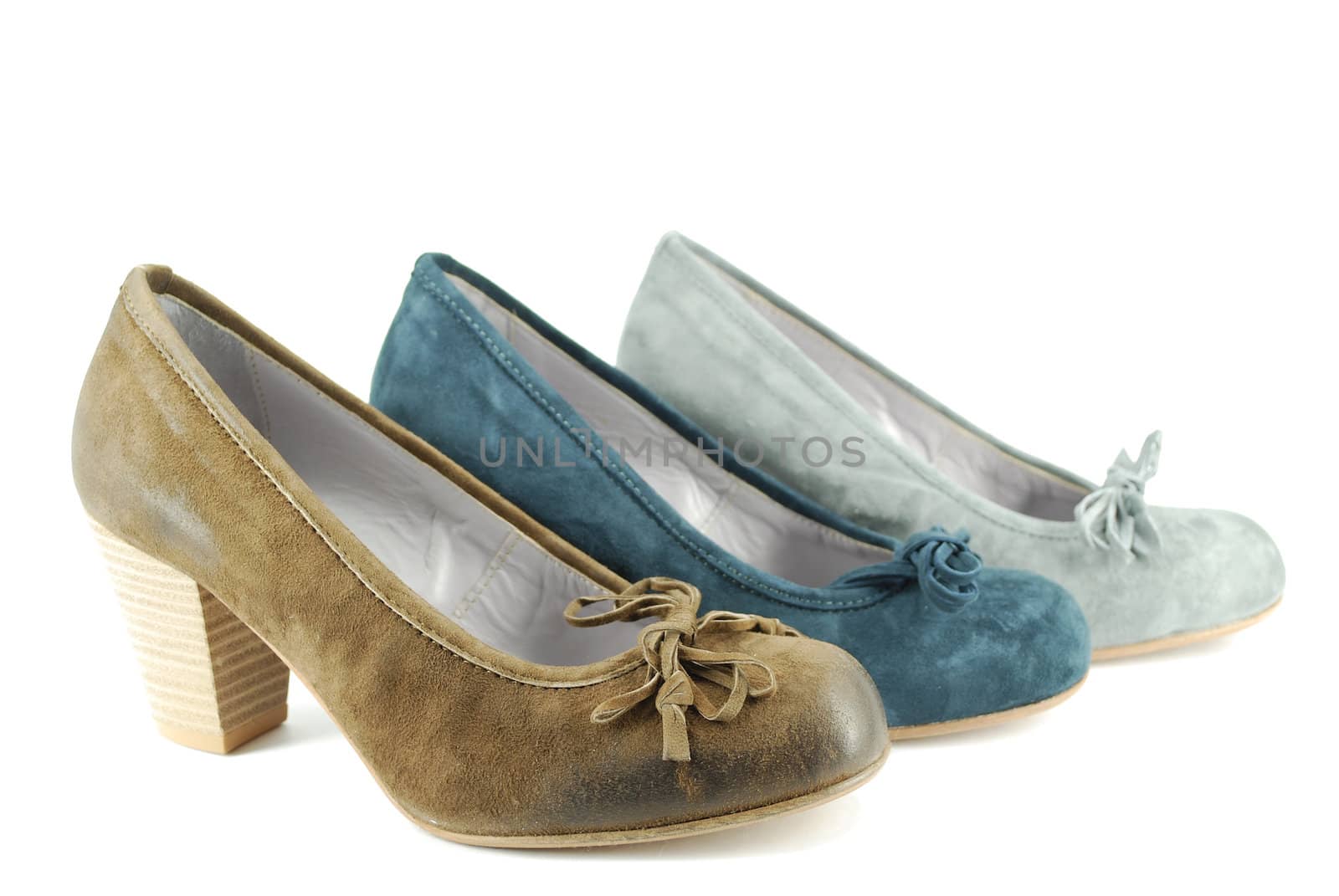 Woman different color shoes on white