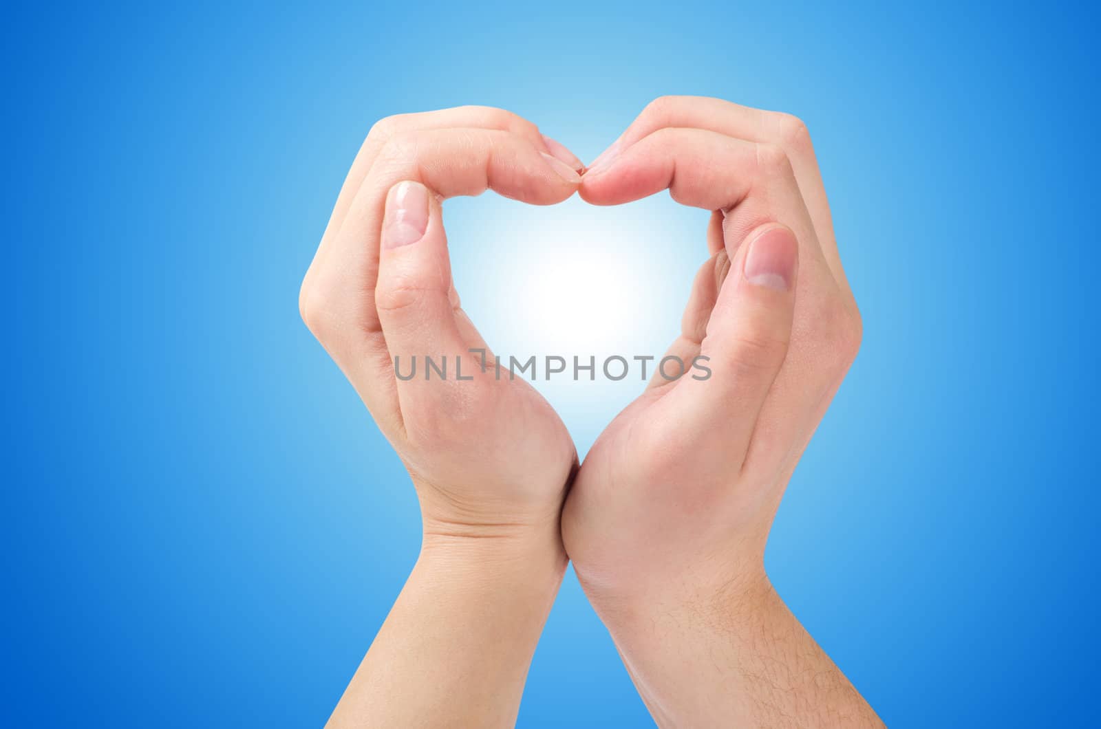 Two hands form a heart shape with their fingers