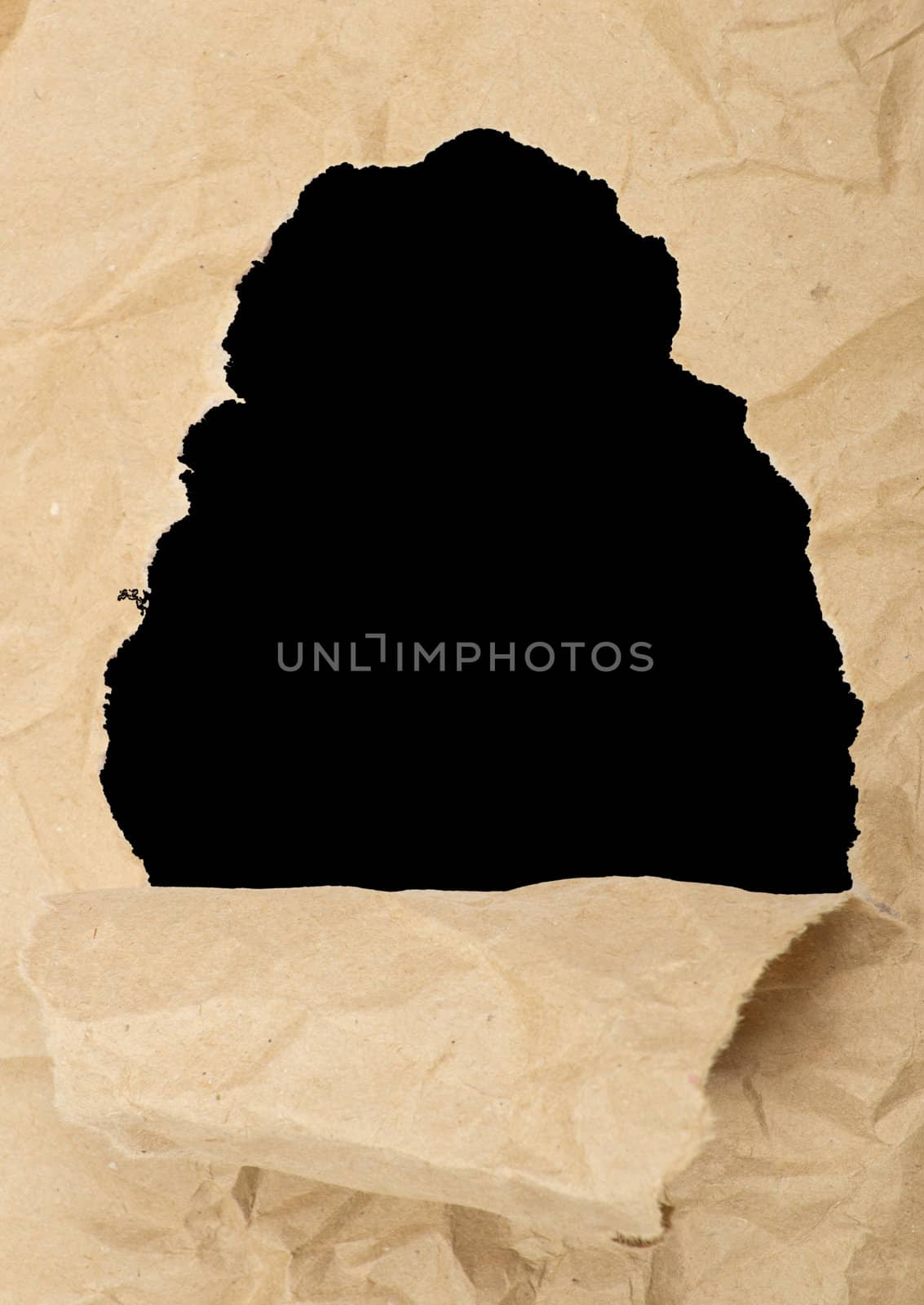 ripped white paper against a black background