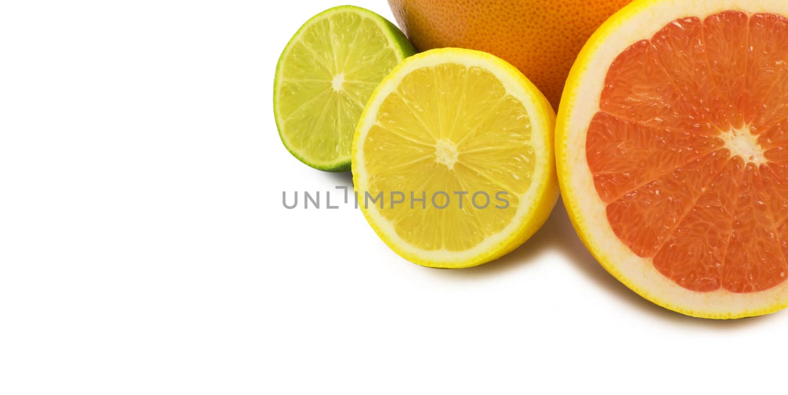 image of a fresh whole lime,lemon and orange isolated on white
