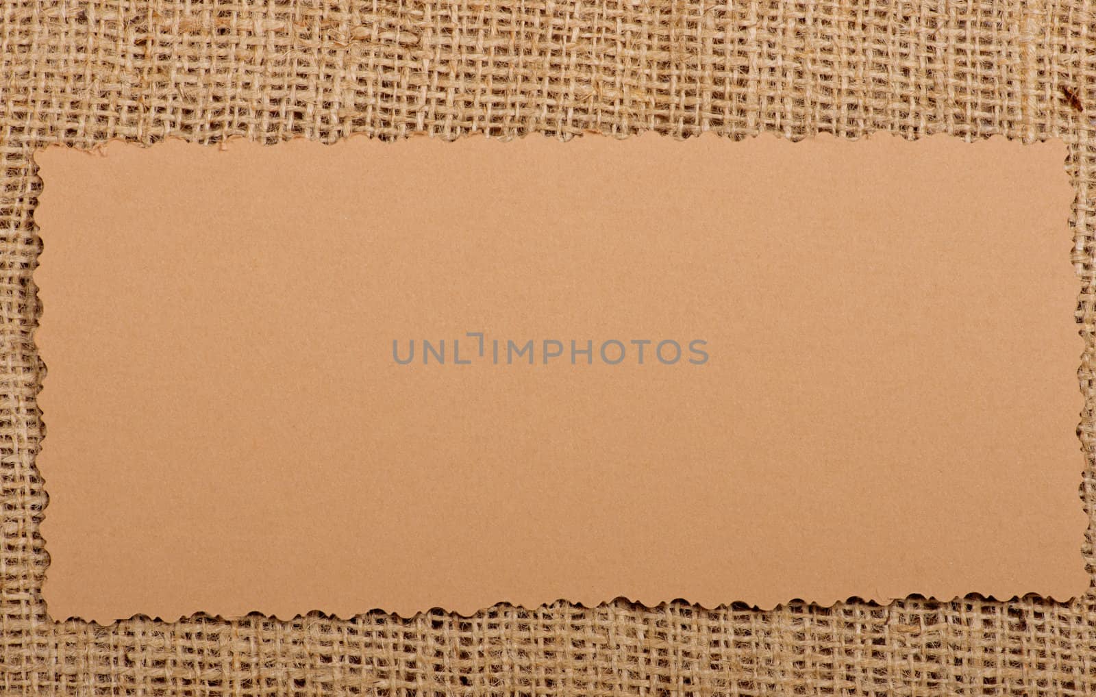 Old paper tag on natural burlap