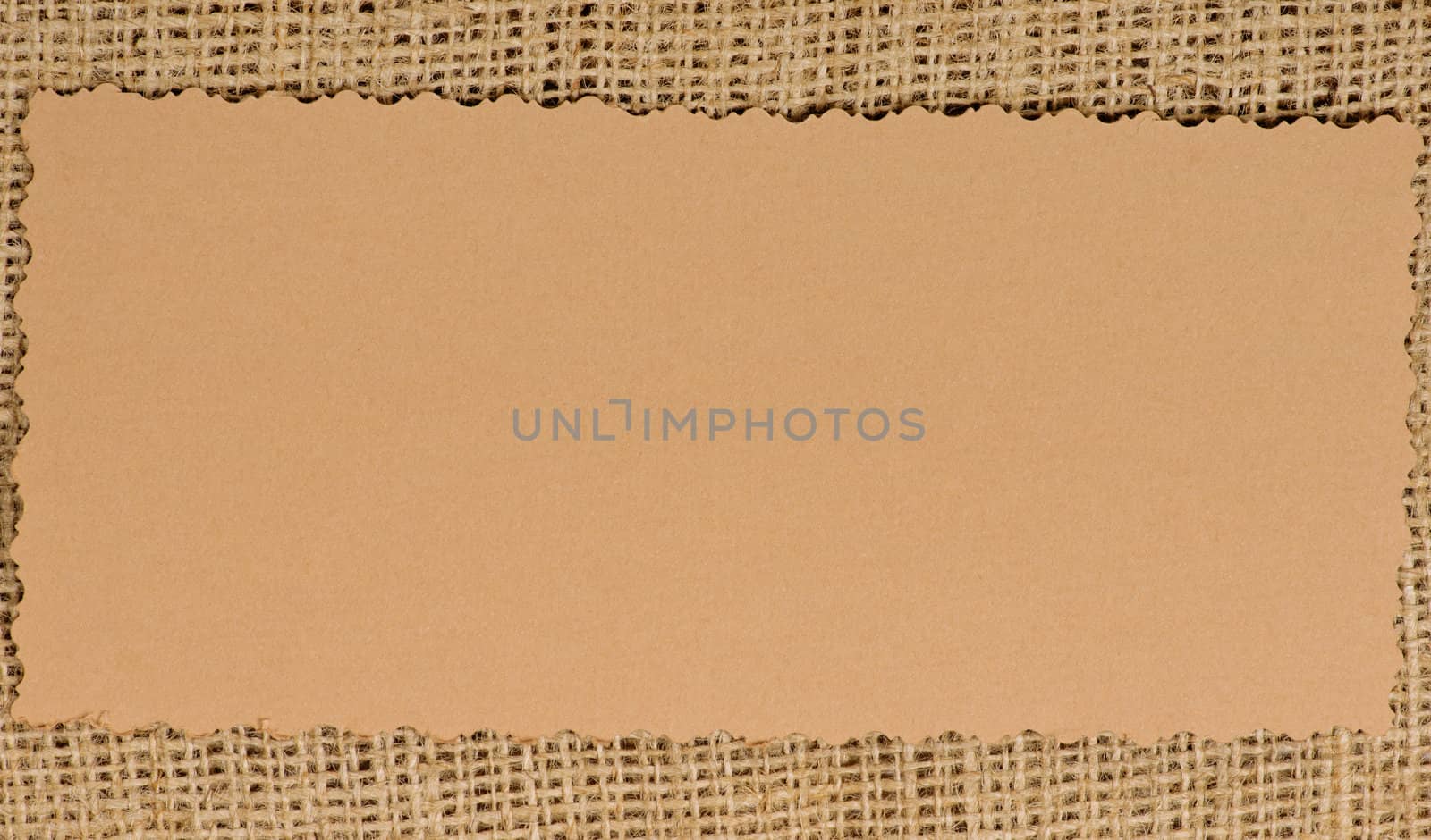 Old paper tag on natural burlap