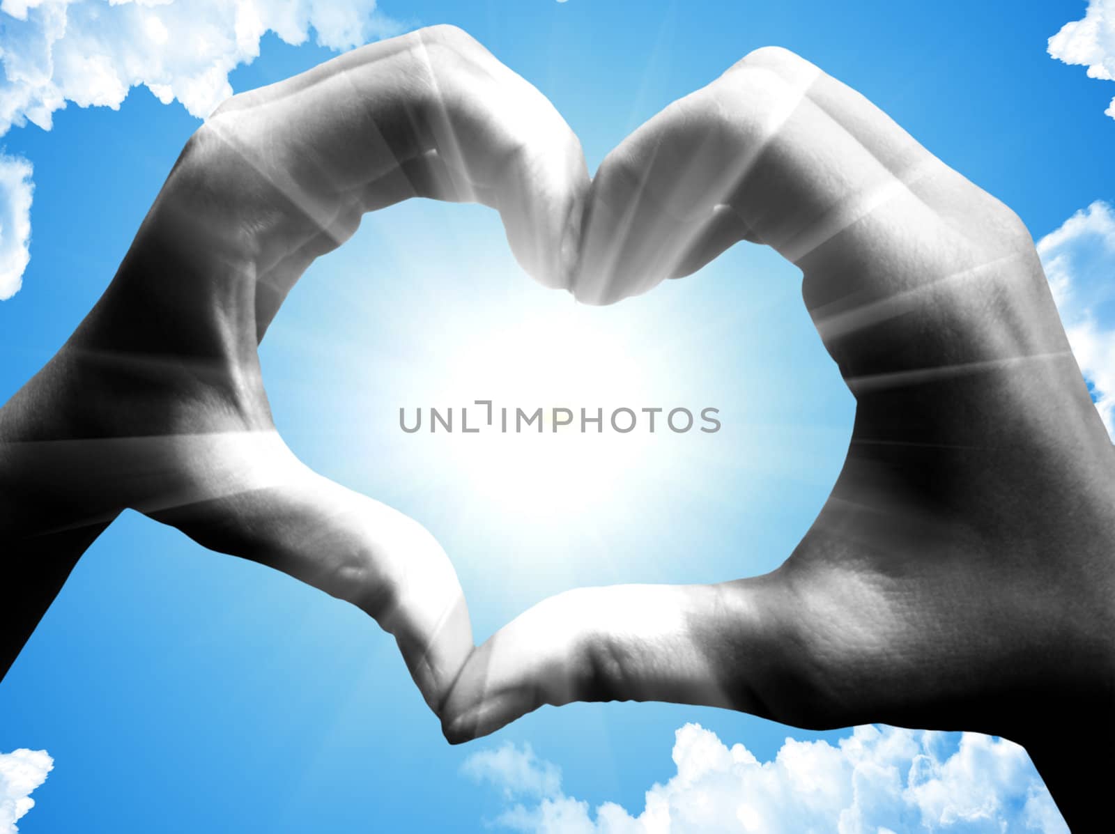 love shape hand silhouette in sky