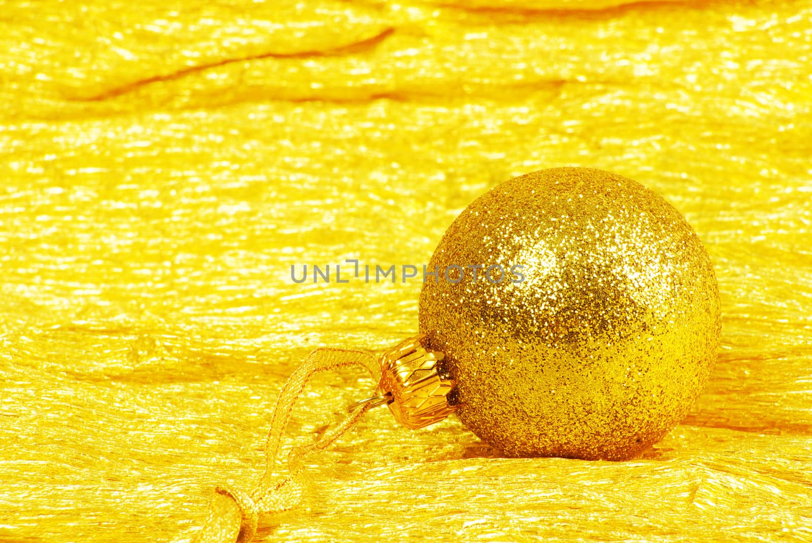 Christmas ball on golden background