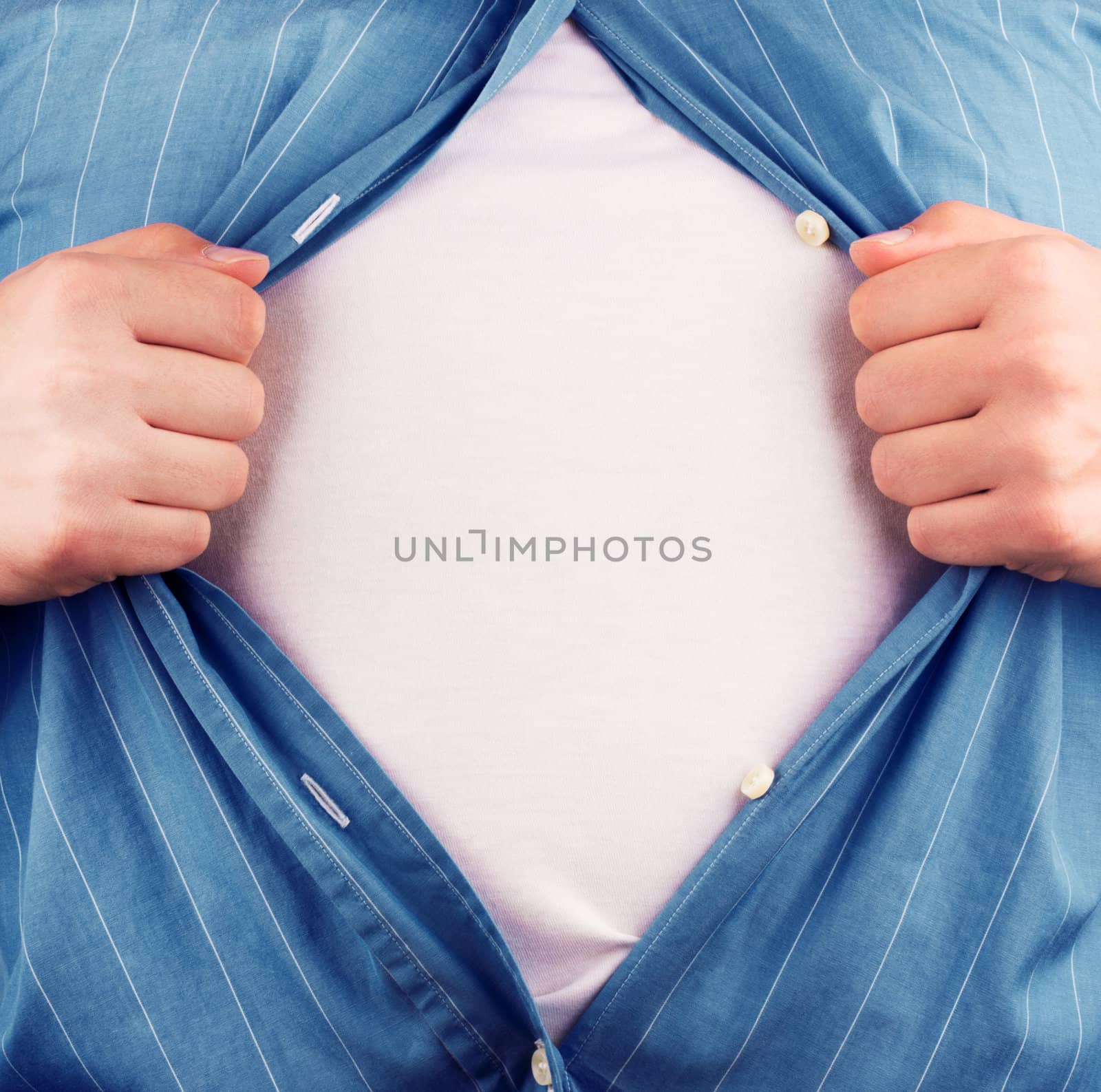 Cropped view of frustrated business man tearing off his shirt