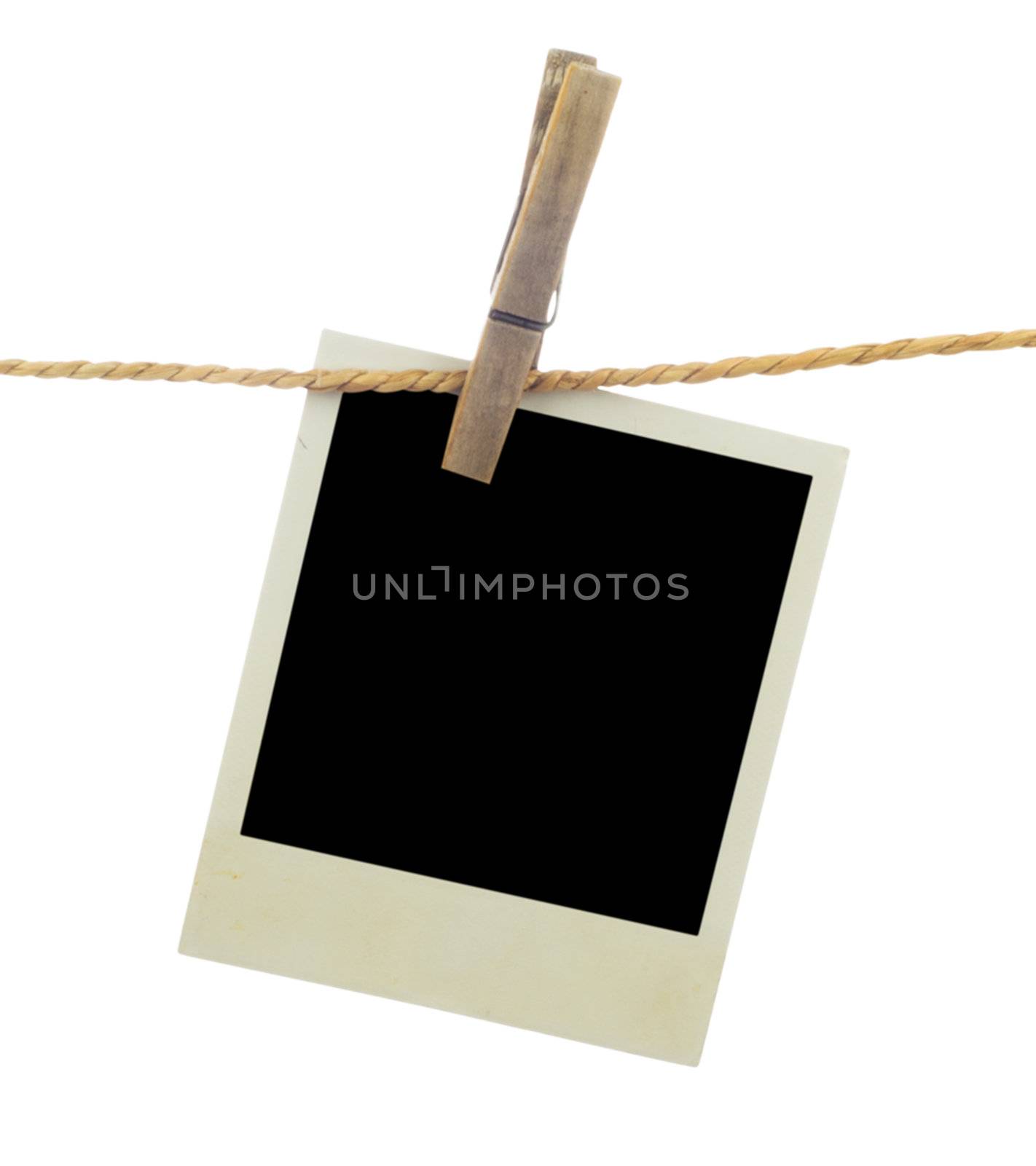 Three blank instant photos hanging on the clothesline. Isolated on white background.