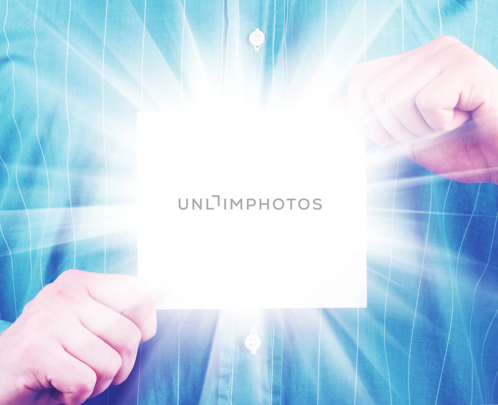 Closeup of businessman's hand holding up card
