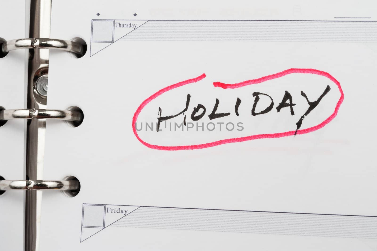 Holiday word written on notebook