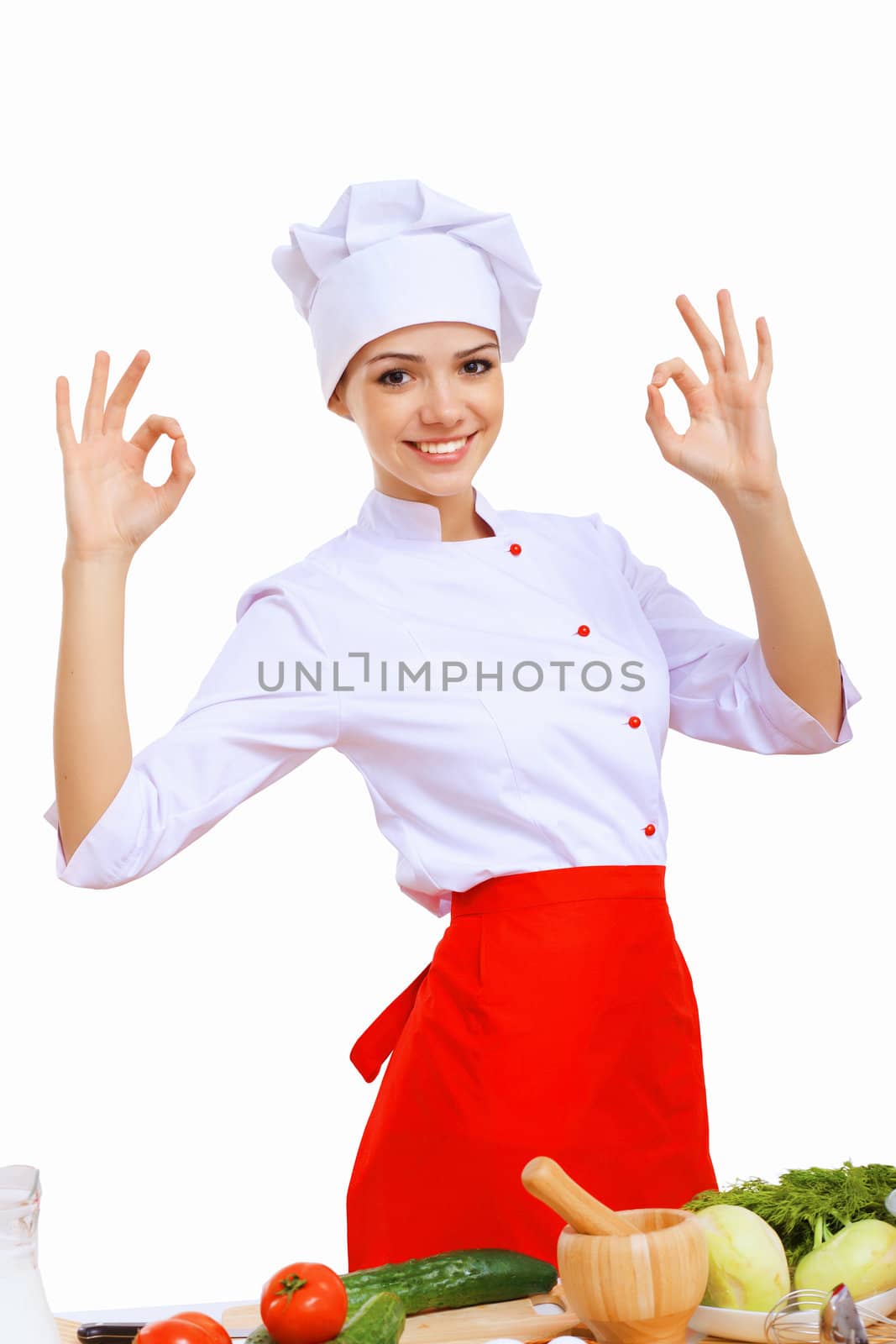 Young cook preparing food wearing a red apron