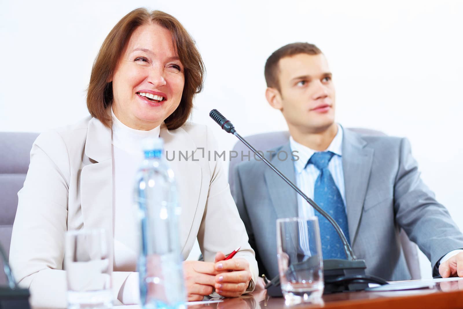 Two businesspeople at meeting by sergey_nivens