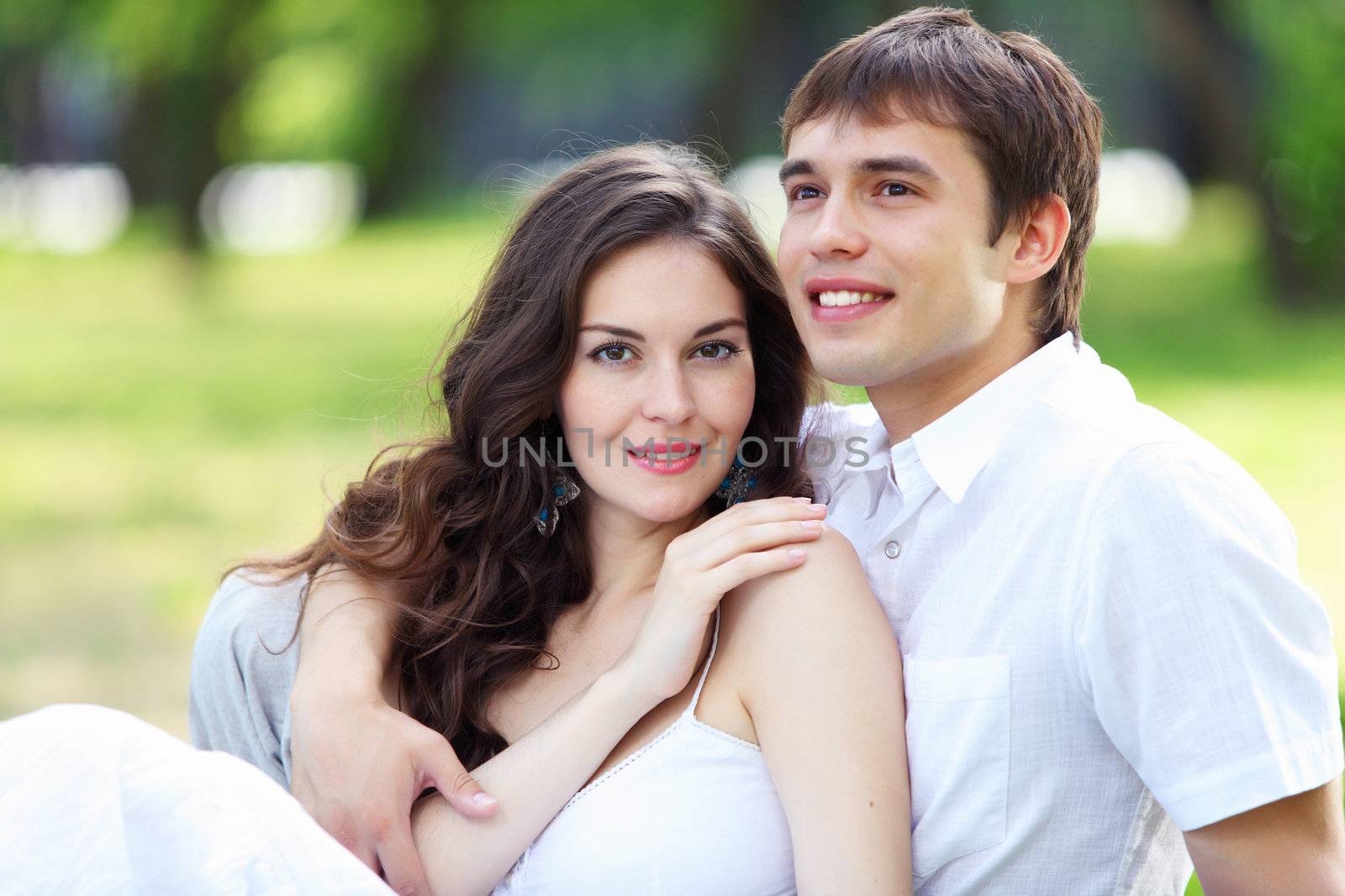 Young love Couple smiling under blue sky by sergey_nivens