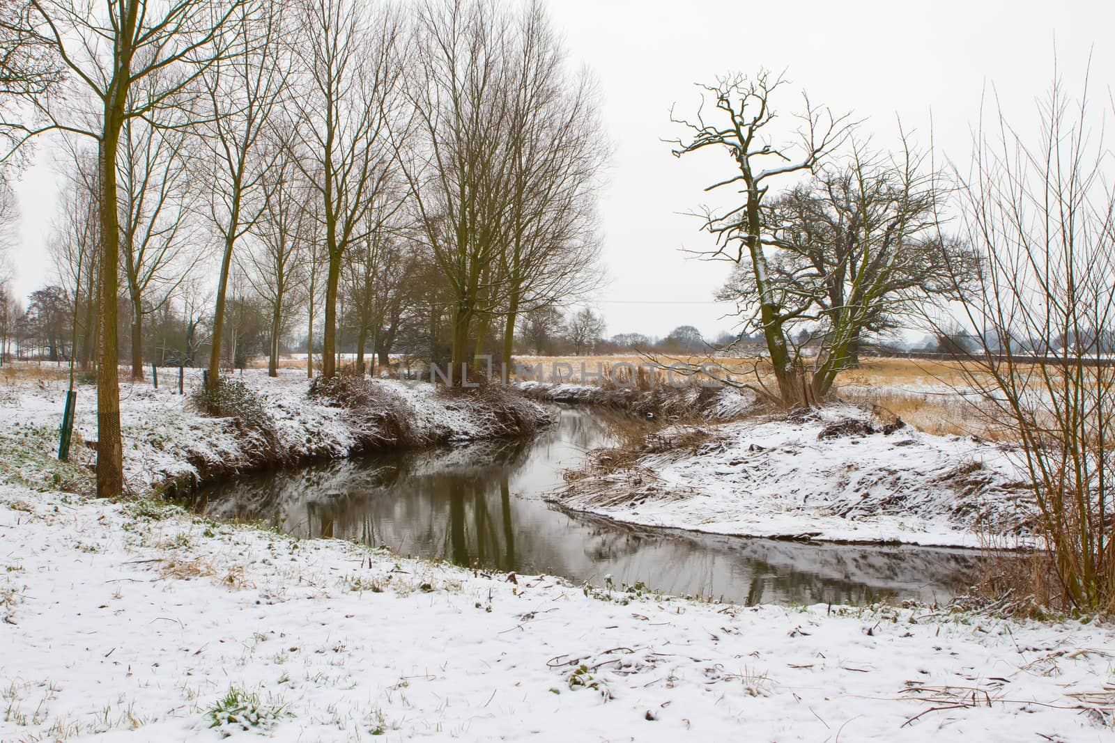 snow scene with river running through