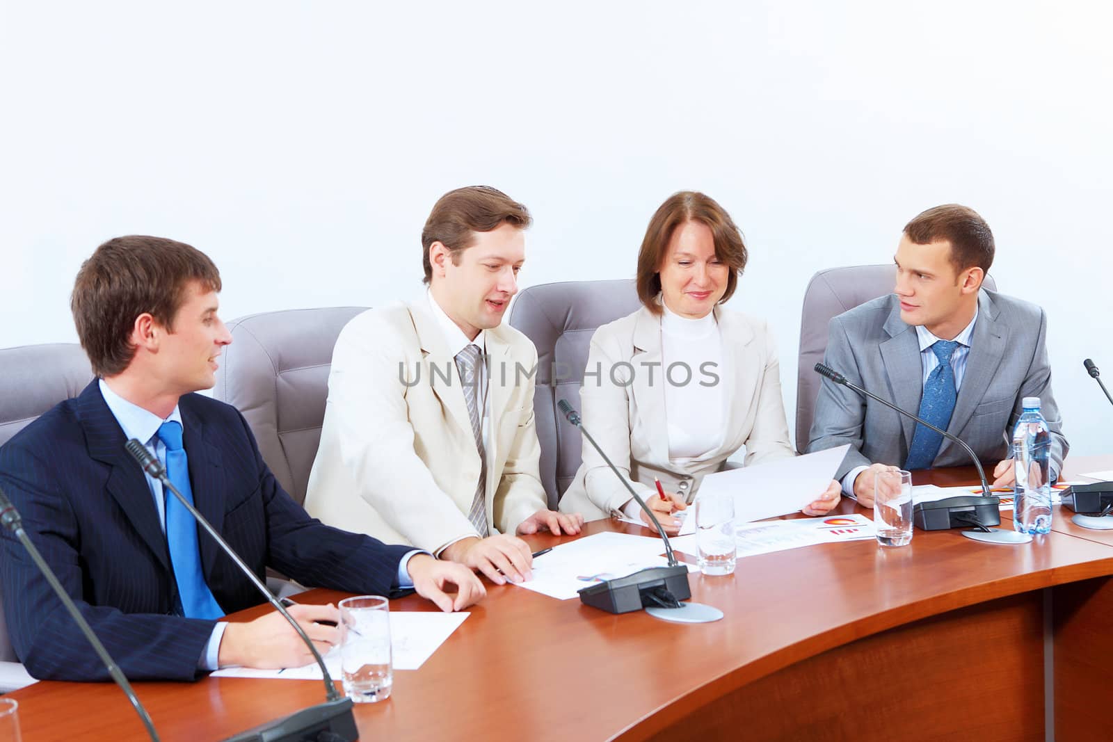 Four businesspeople at meeting by sergey_nivens