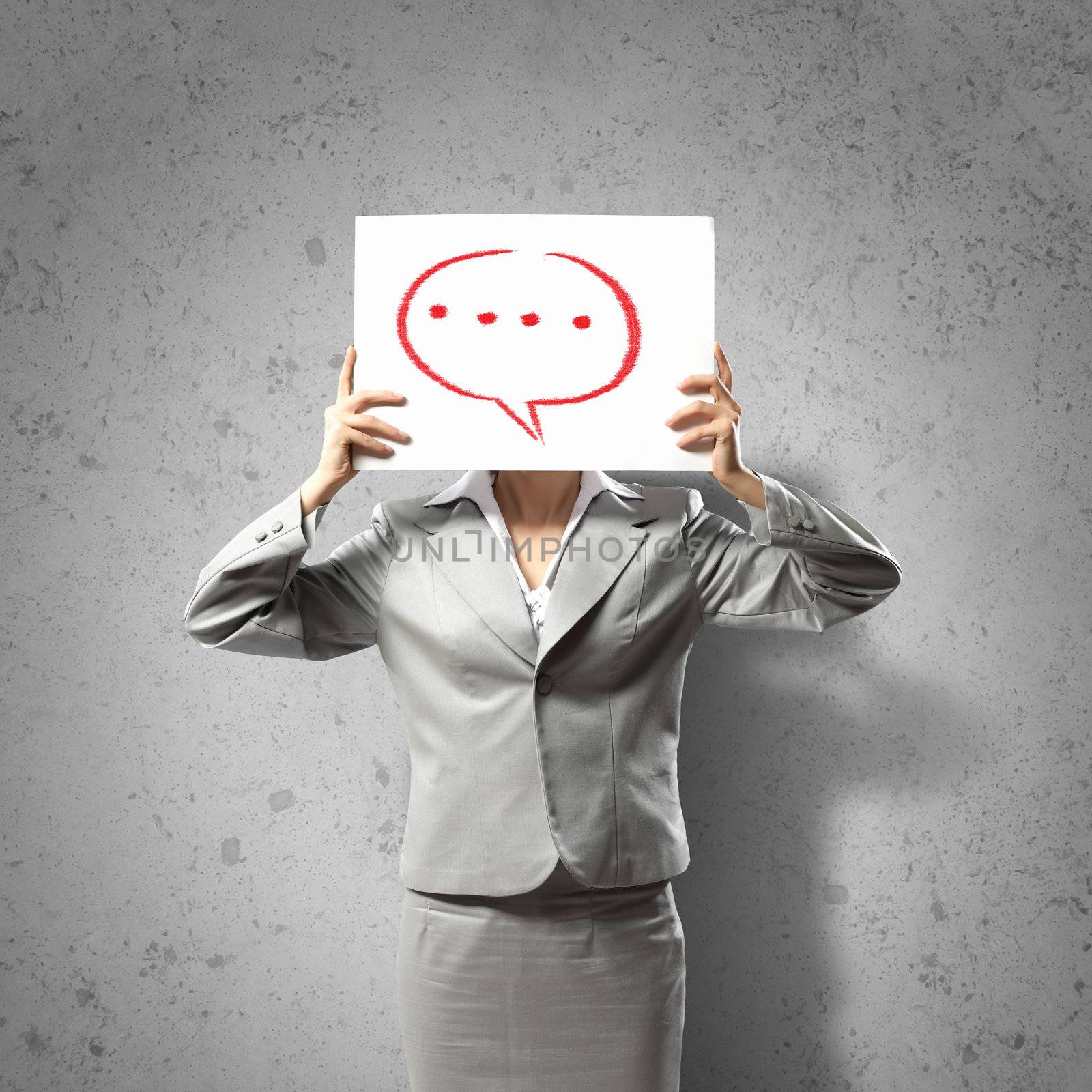 Image of businesswoman holding message board against face. Conceptual photo