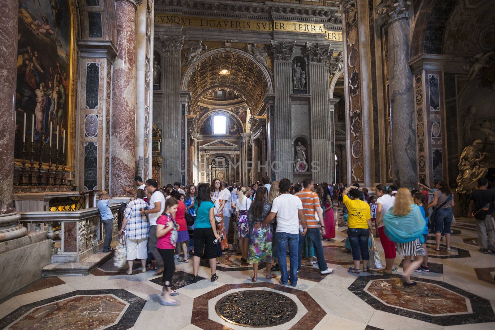 ROME - June 22: Crowd of tourists Indoor St. Peter's Basilica on June 22, 2012 in Rome, Italy. St. Peter's Basilica is a Late Renaissance church one of largest Christian church in world