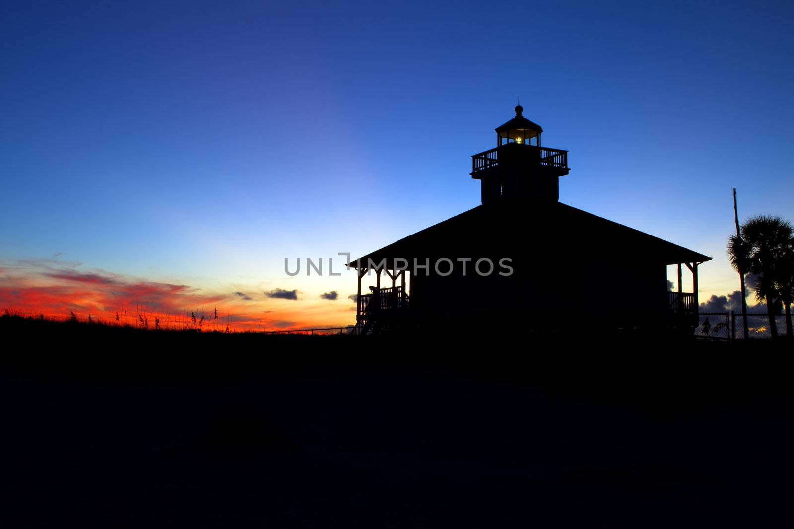Sunset over a small light house