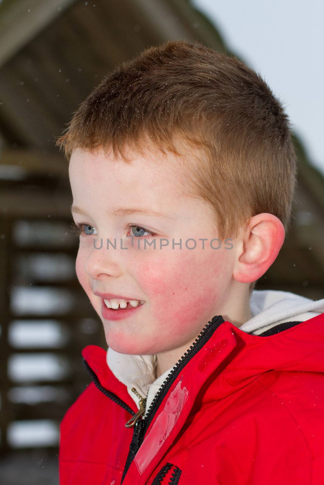 young boy smiling in the snow by smikeymikey1