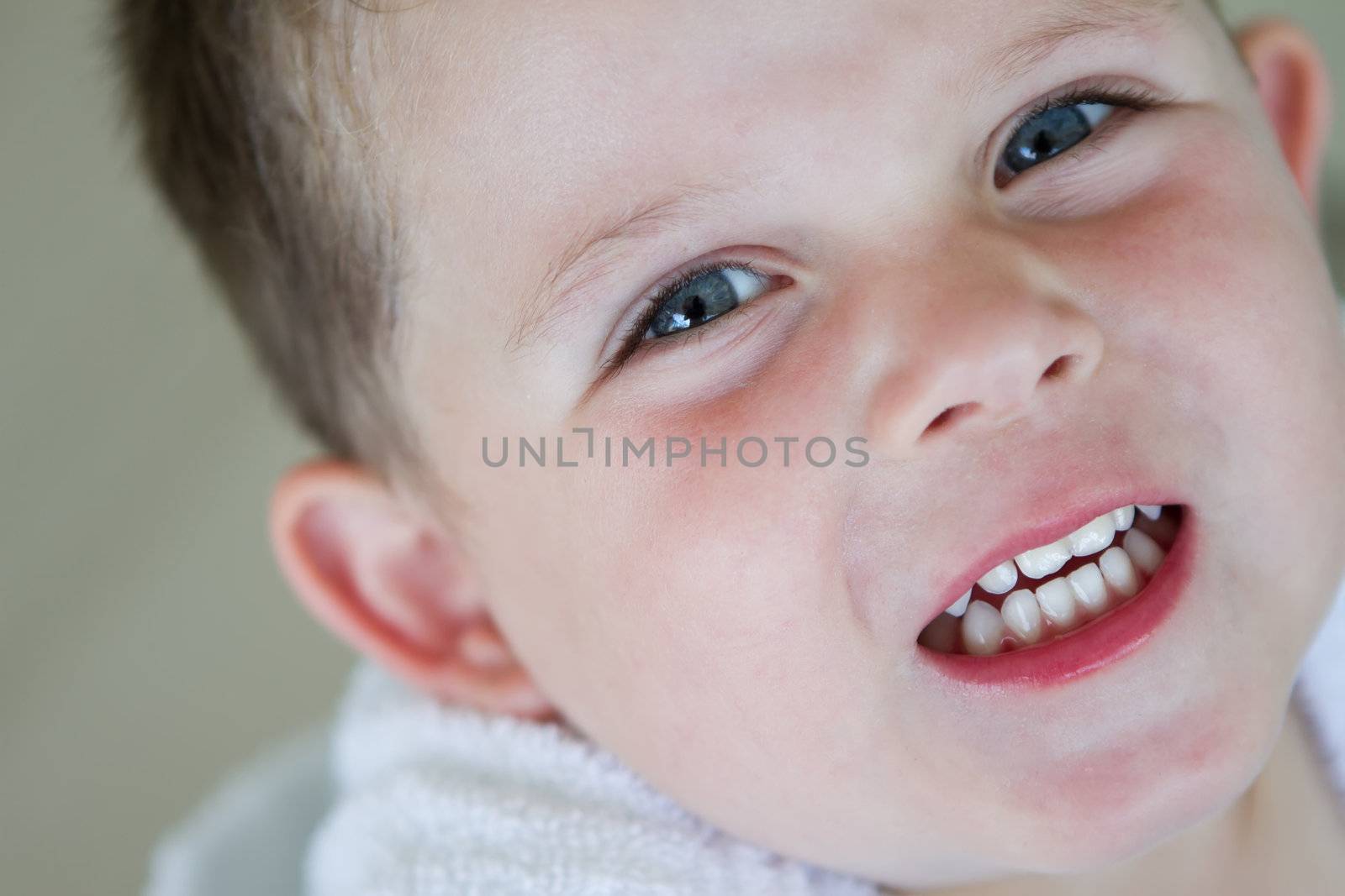 little boy smiling wearing his bath robe