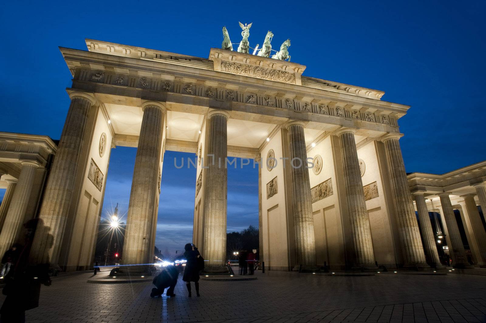 Low angle view of the historical Brandenburg Gate, or Brandenburger Tor, Berlin, Germany illuminated at night