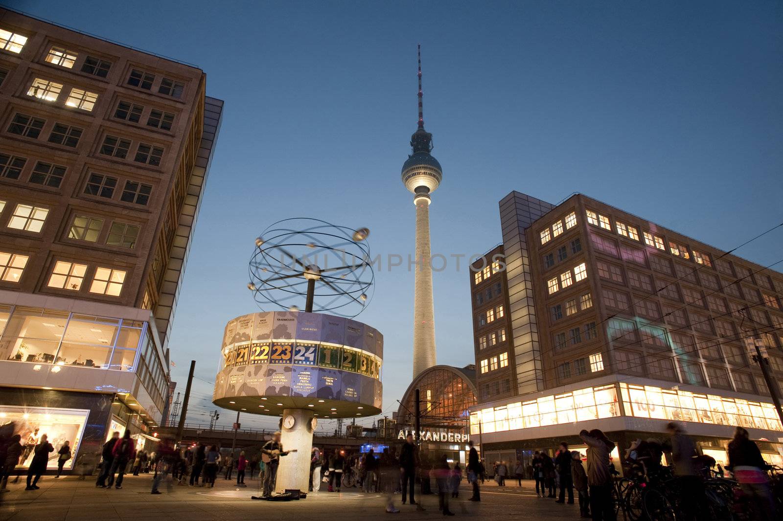 the main landmarks in alexanderplatz berlin, the fernsehturm tv tower and weltzeituhr world clock