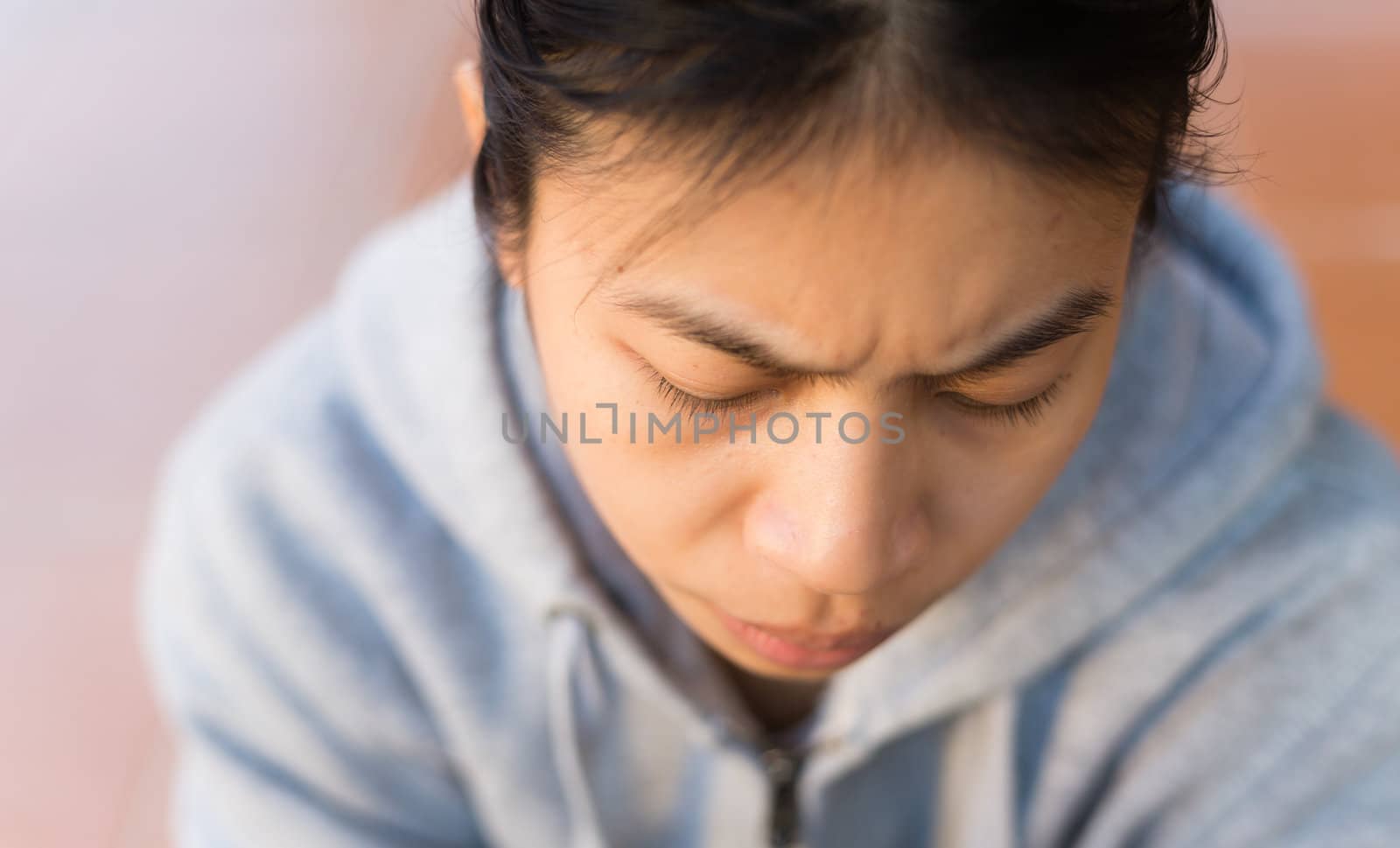 face of asian girl stress and worry