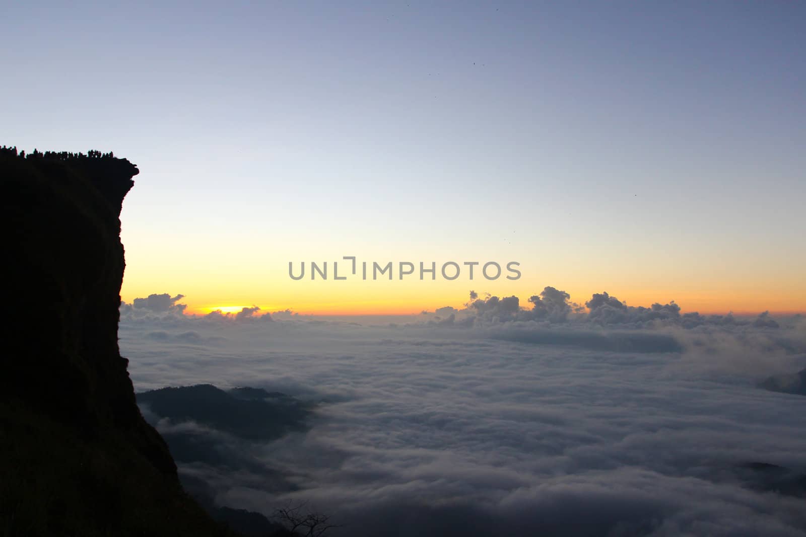 Sunrise scene with the peak and cloudscape at Phu chi fa in Chia by bajita111122