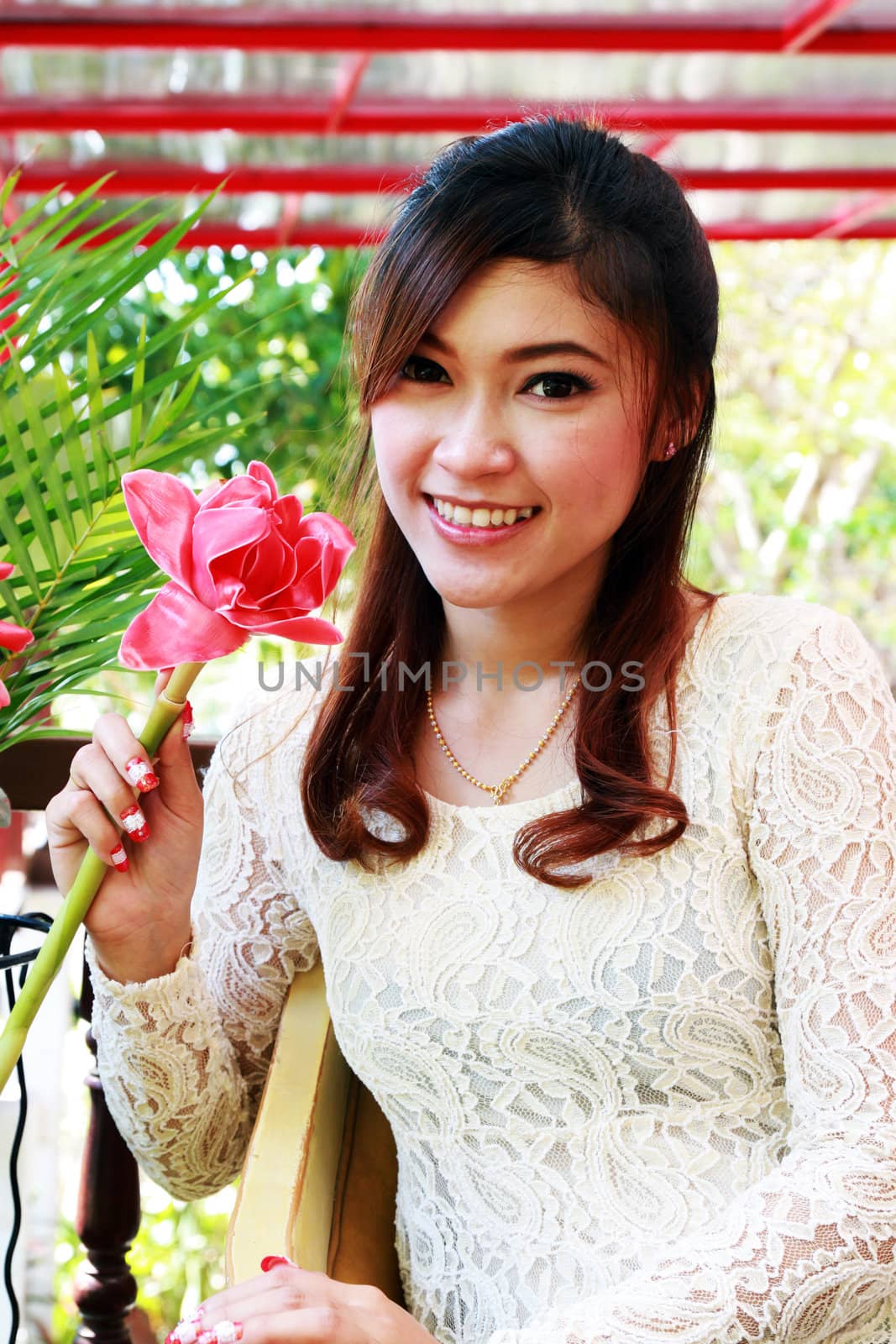 portrait of asian woman with pink flower by geargodz