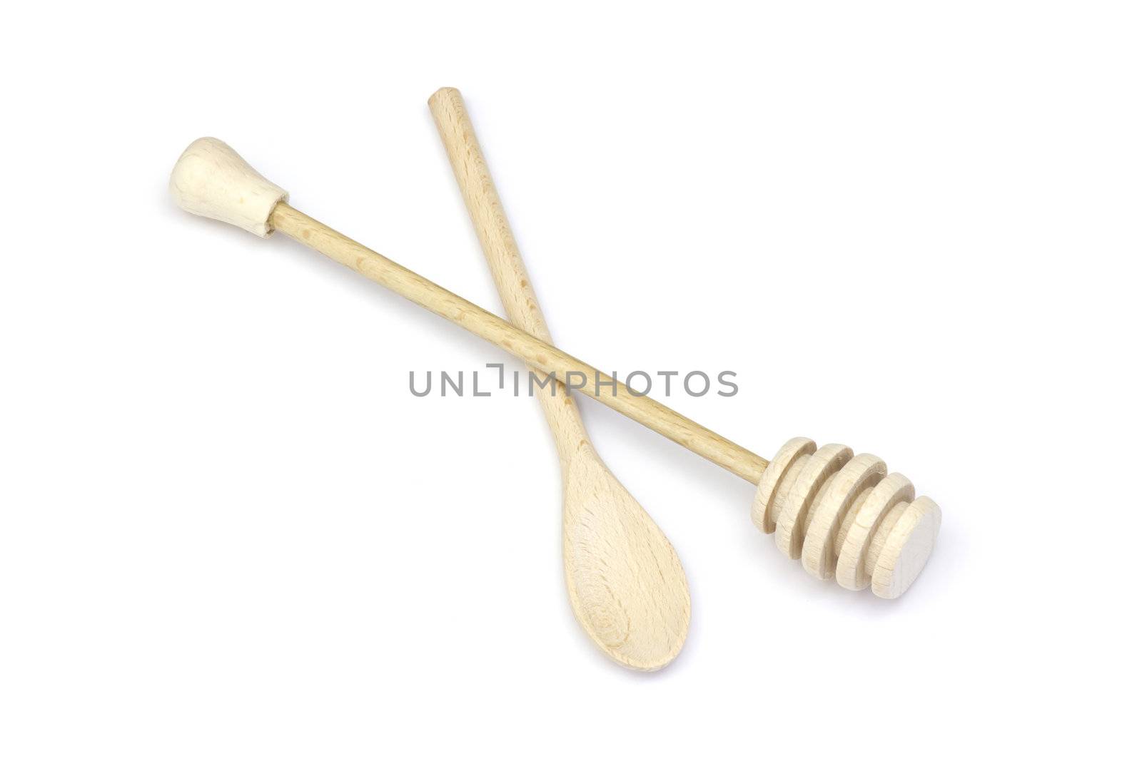 Wooden honey dipper and spoon isolated on white background