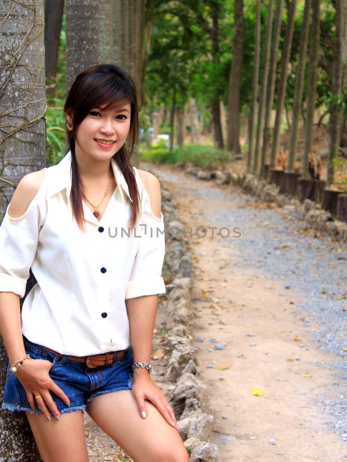 Portrait of the beautiful asian girl on the nature