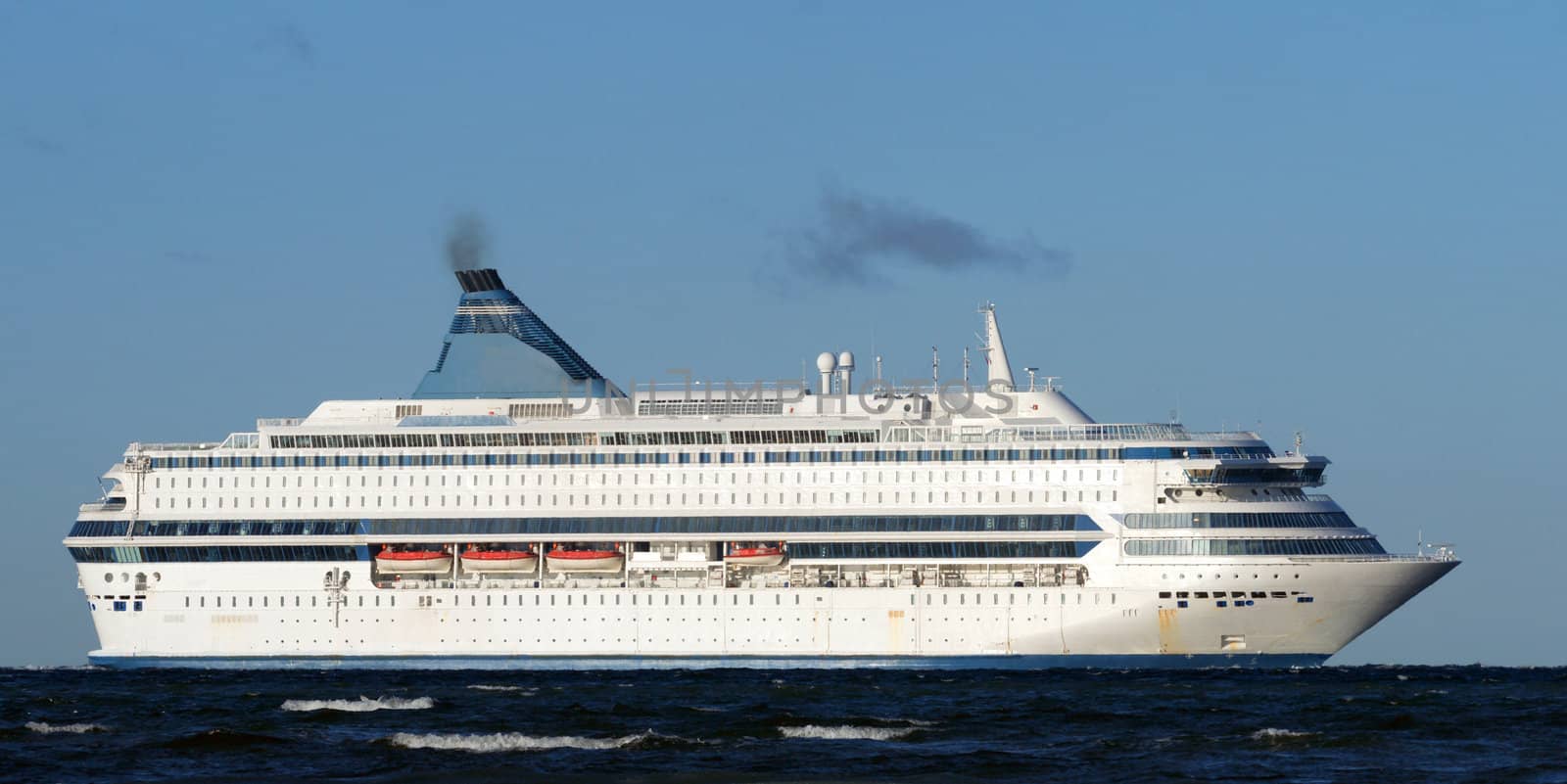 White passenger ferry on a background of the blue sky