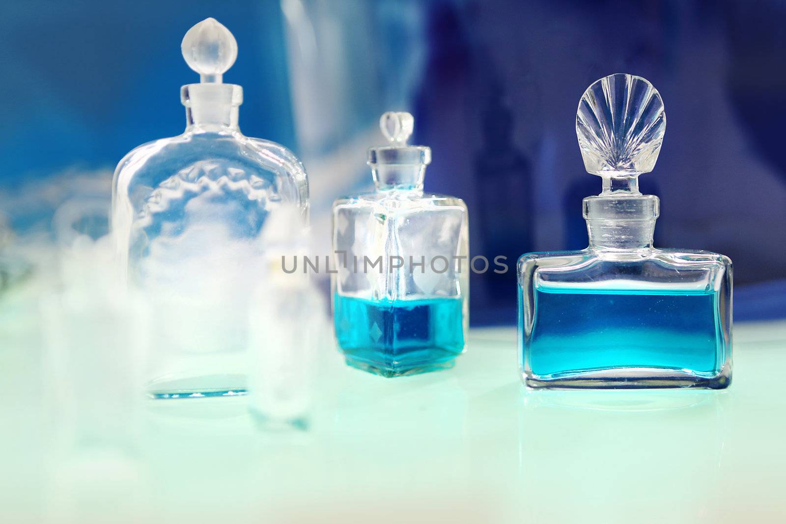 Perfume  on the green table