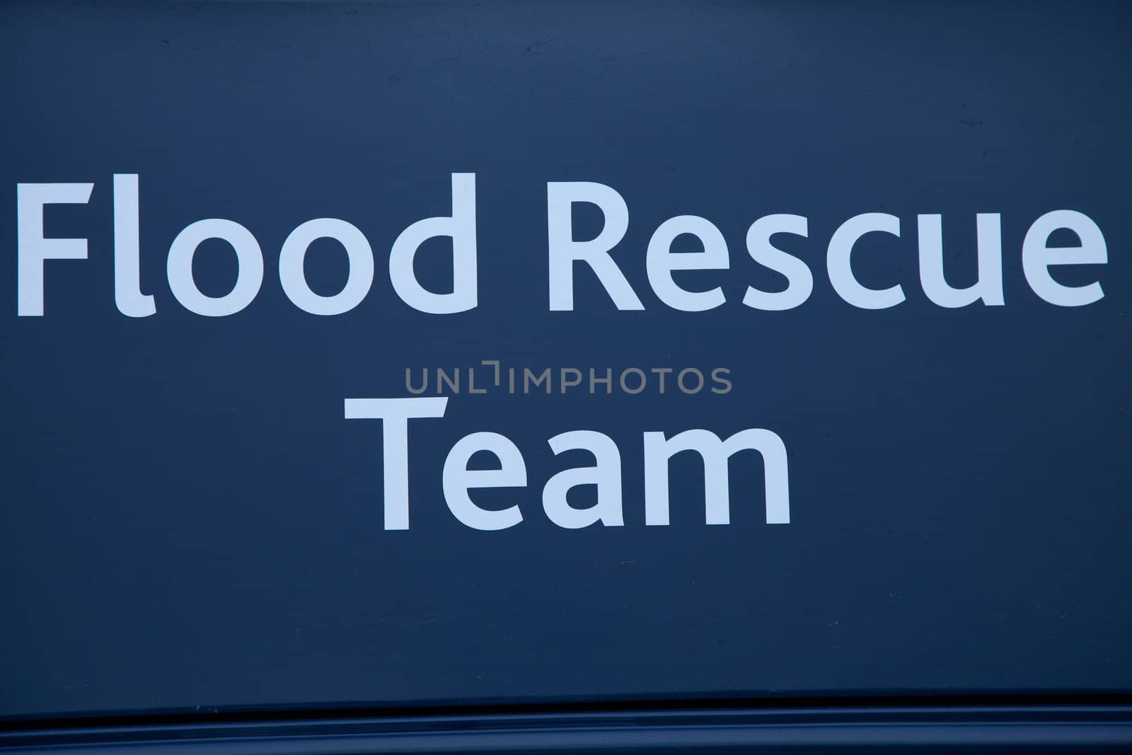 The words 'Flood Rescue Team' written in white on a dark blue background.