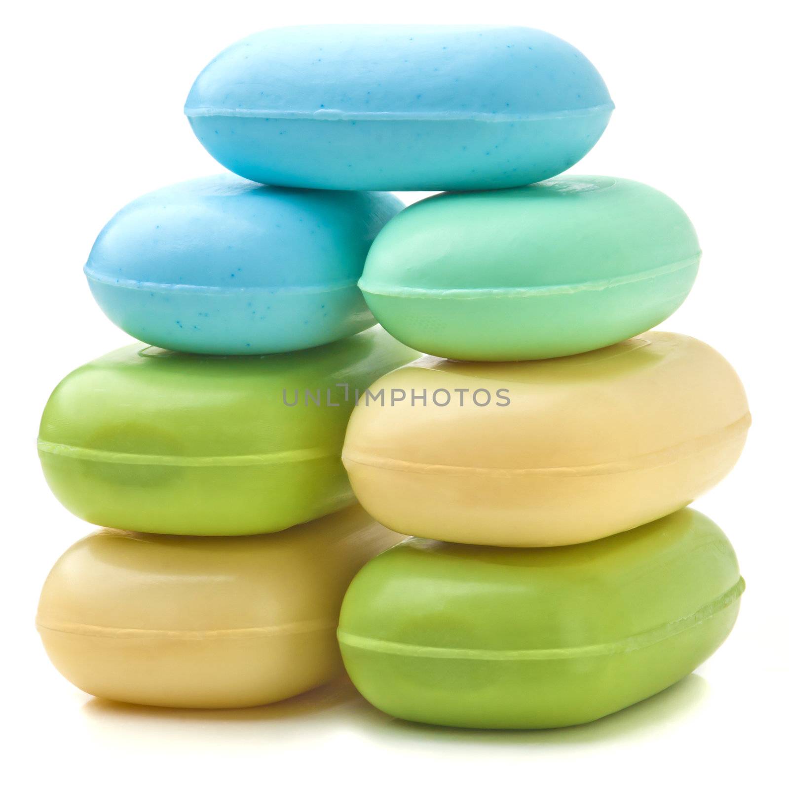 Stack of new colorful Soap Bars on white background.