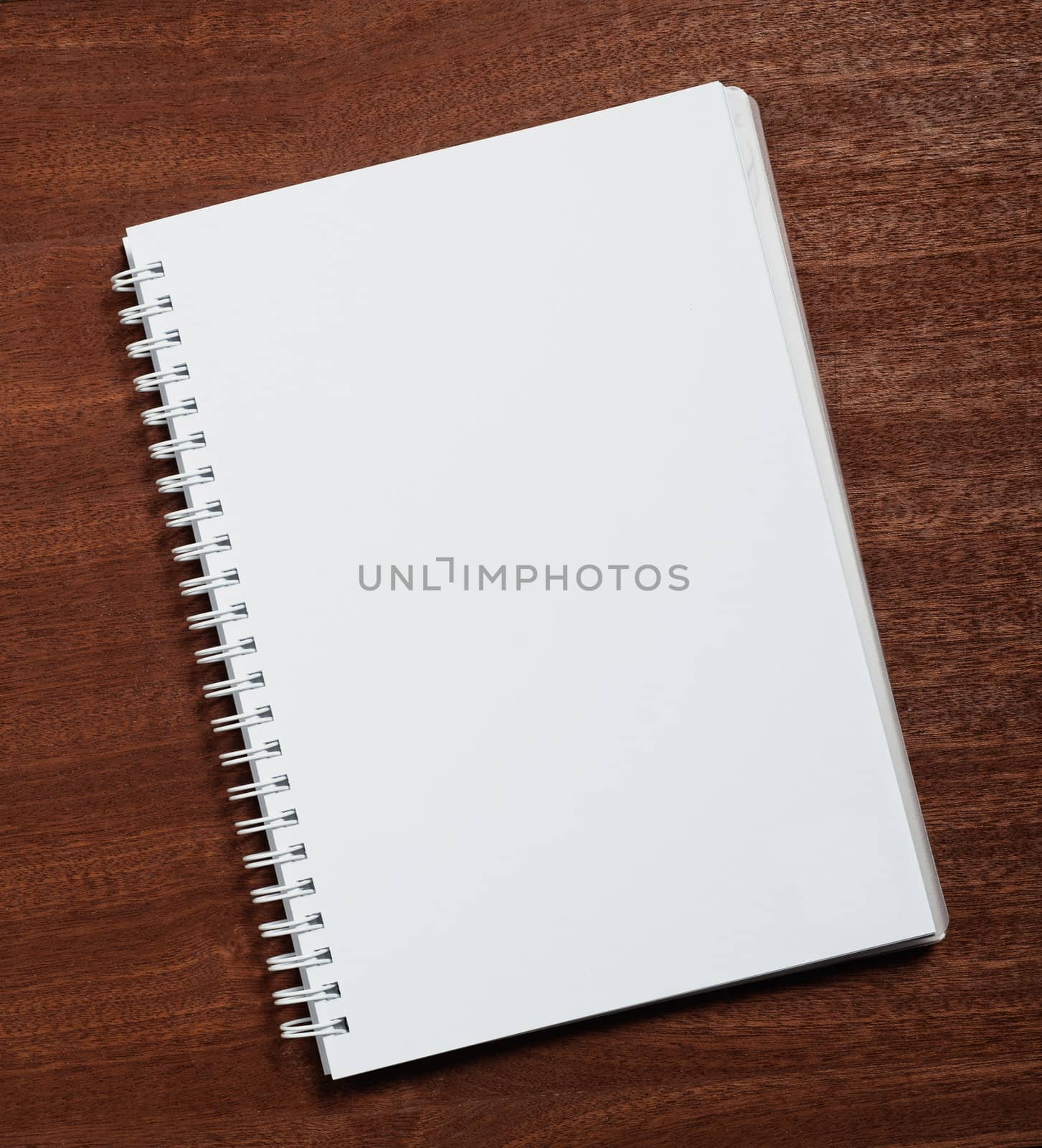 Notebook on wooden background. 
