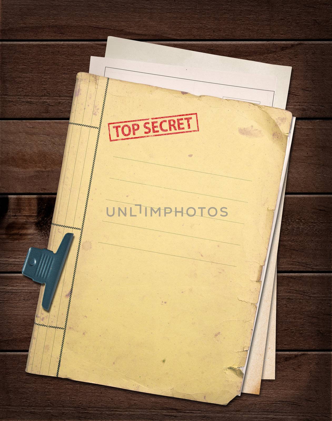 top secret file on wooden table.