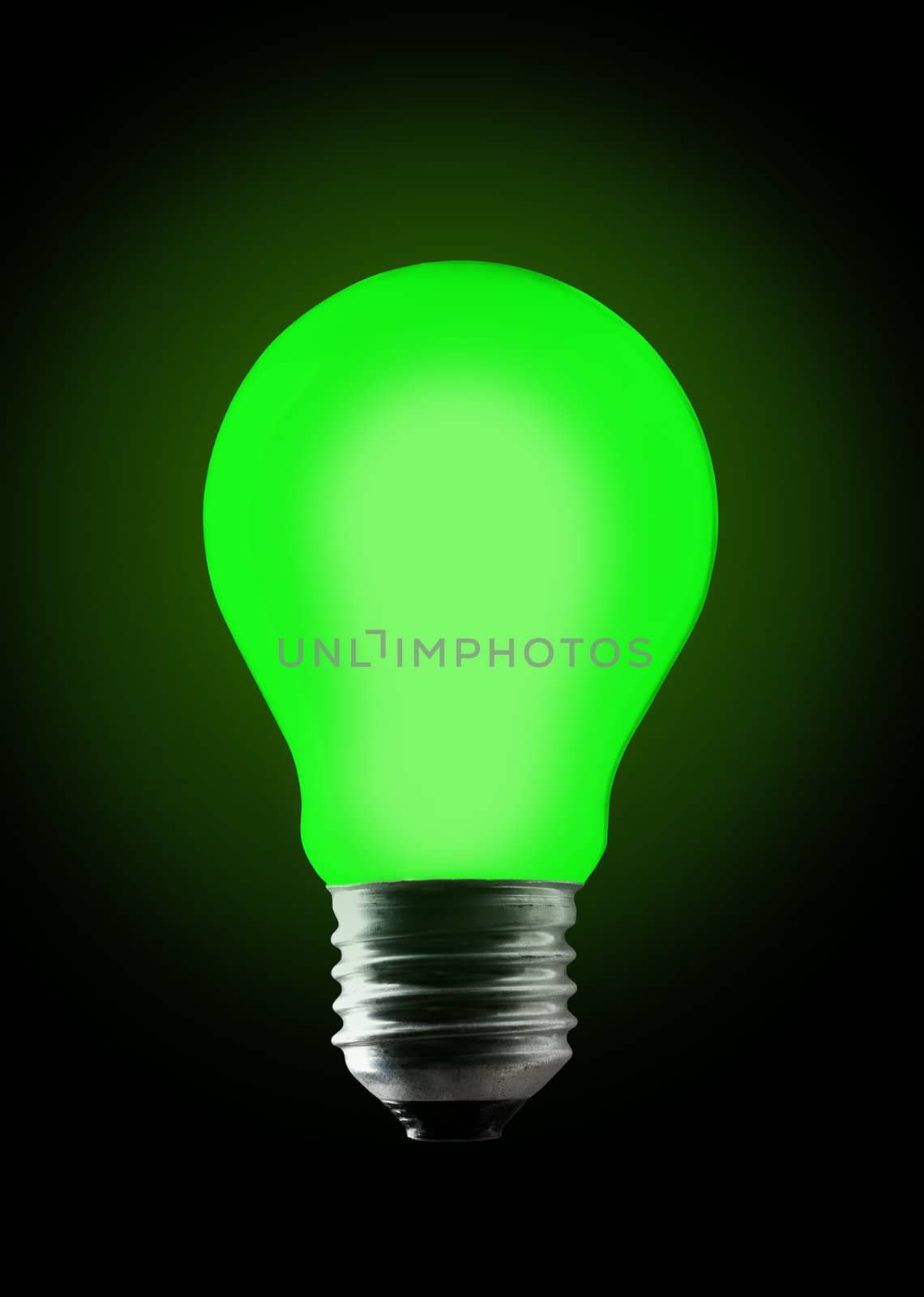 Green light bulb on black background.