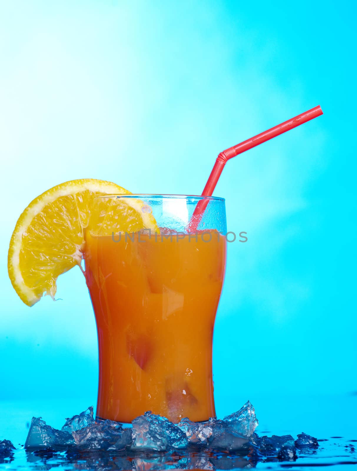 tropical coctail drink with ice cubs,closeup