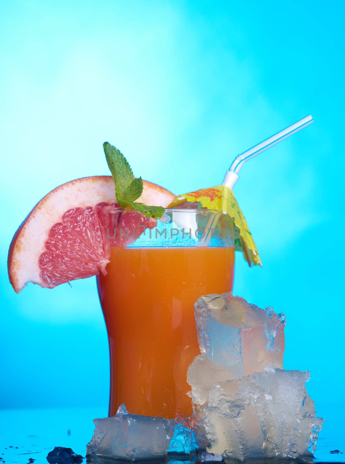 tropical coctail drink with ice cubs,closeup