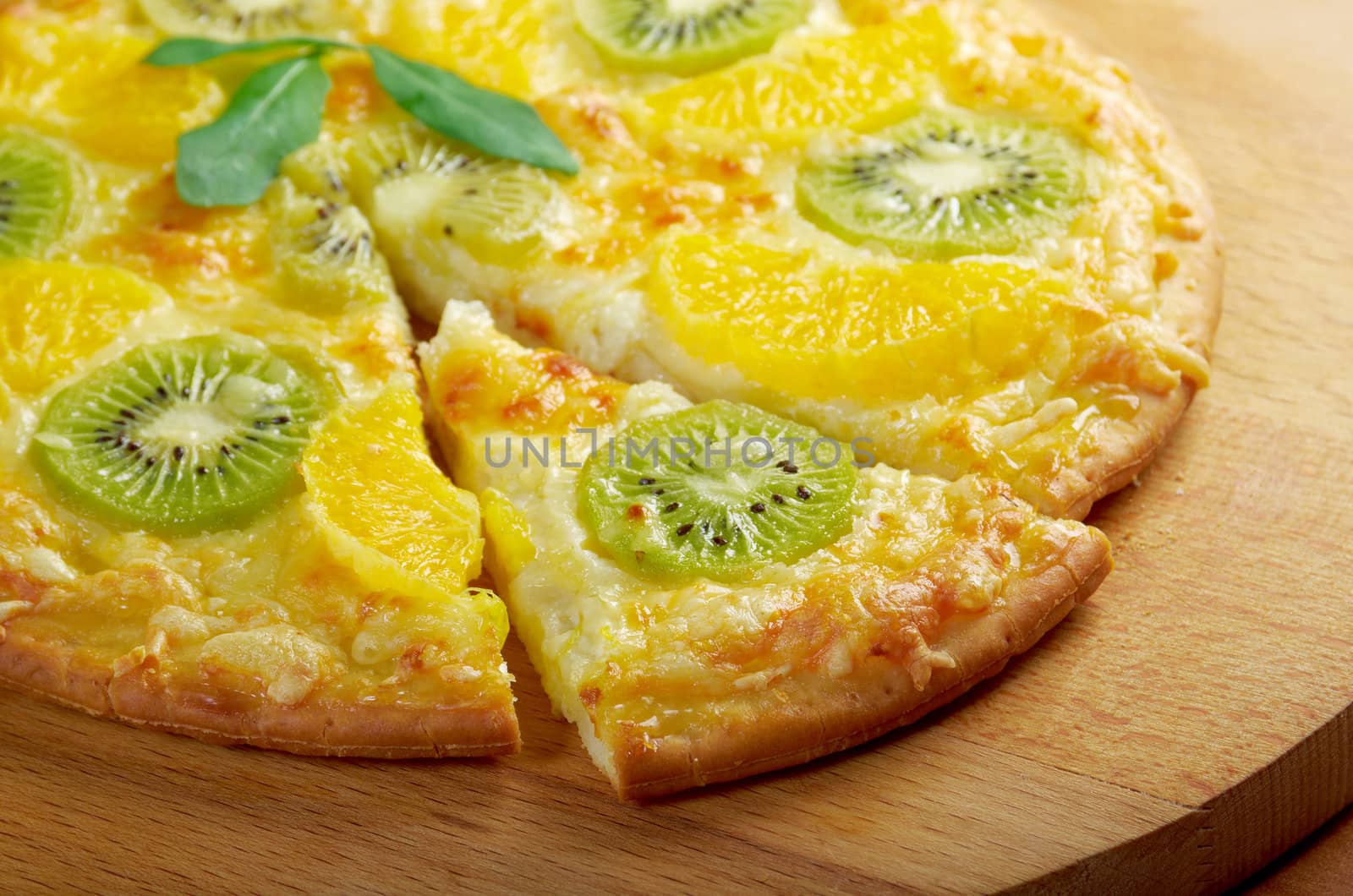 homemade sweet pizza with fruit.with orang kiwi,sauce