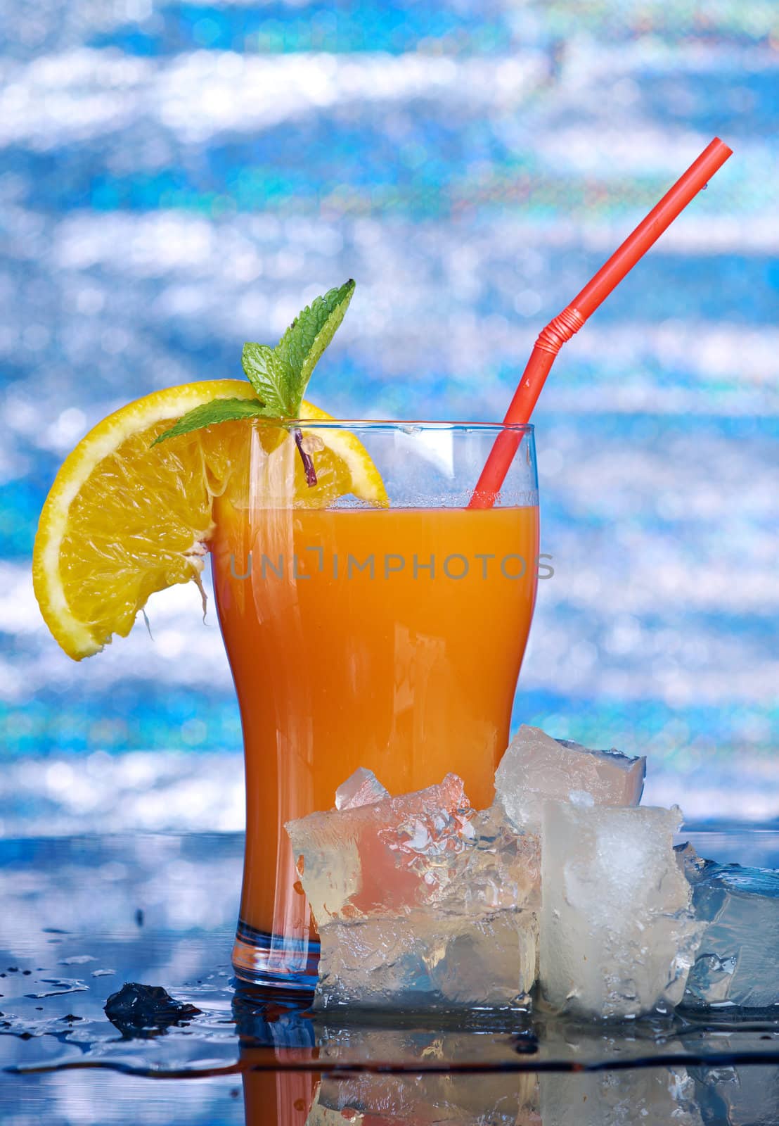 tropical coctail drink with ice cubs,closeup